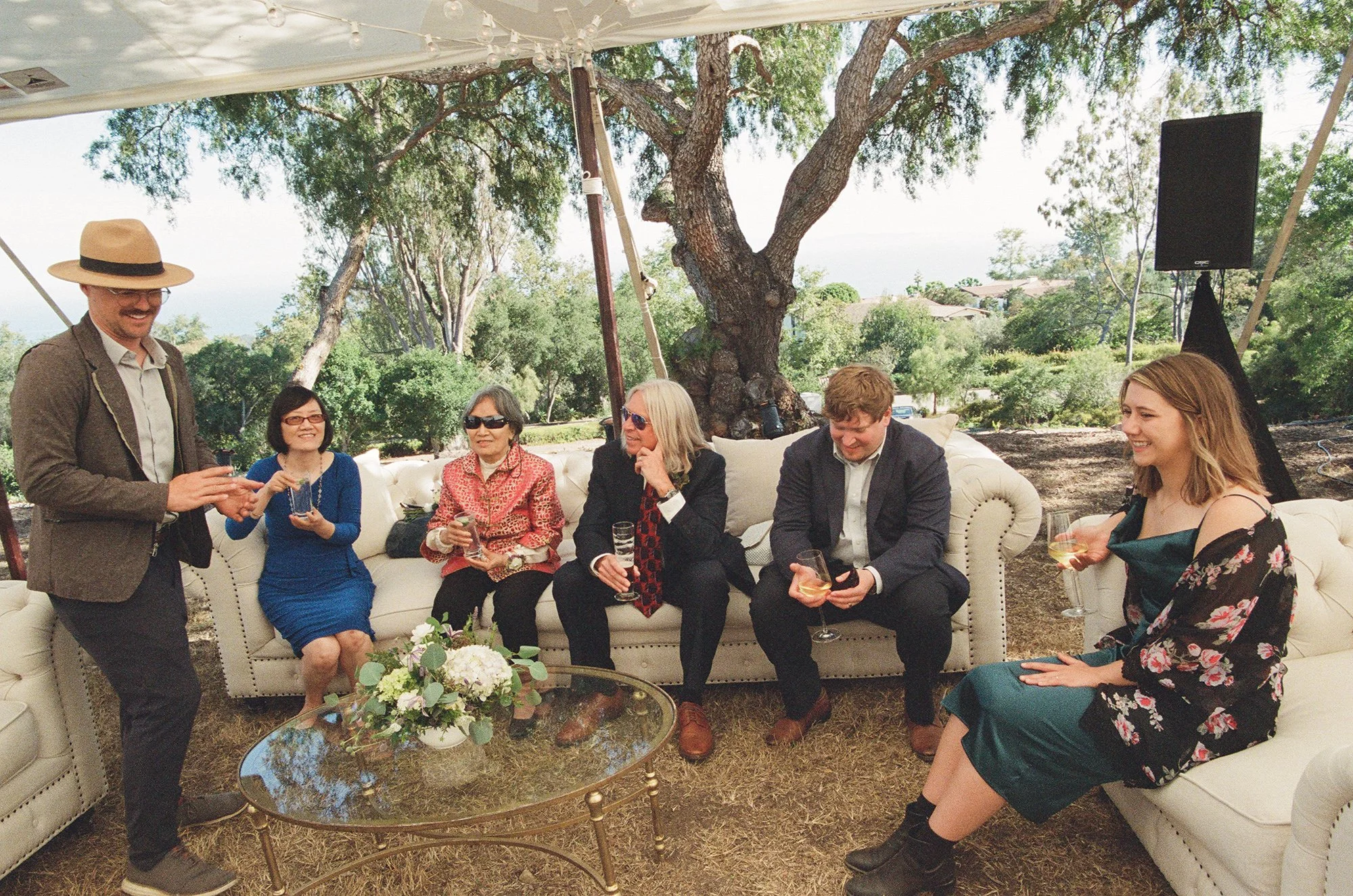 guests at an outdoor wedding lounge photographed by Michael and Anna Costa