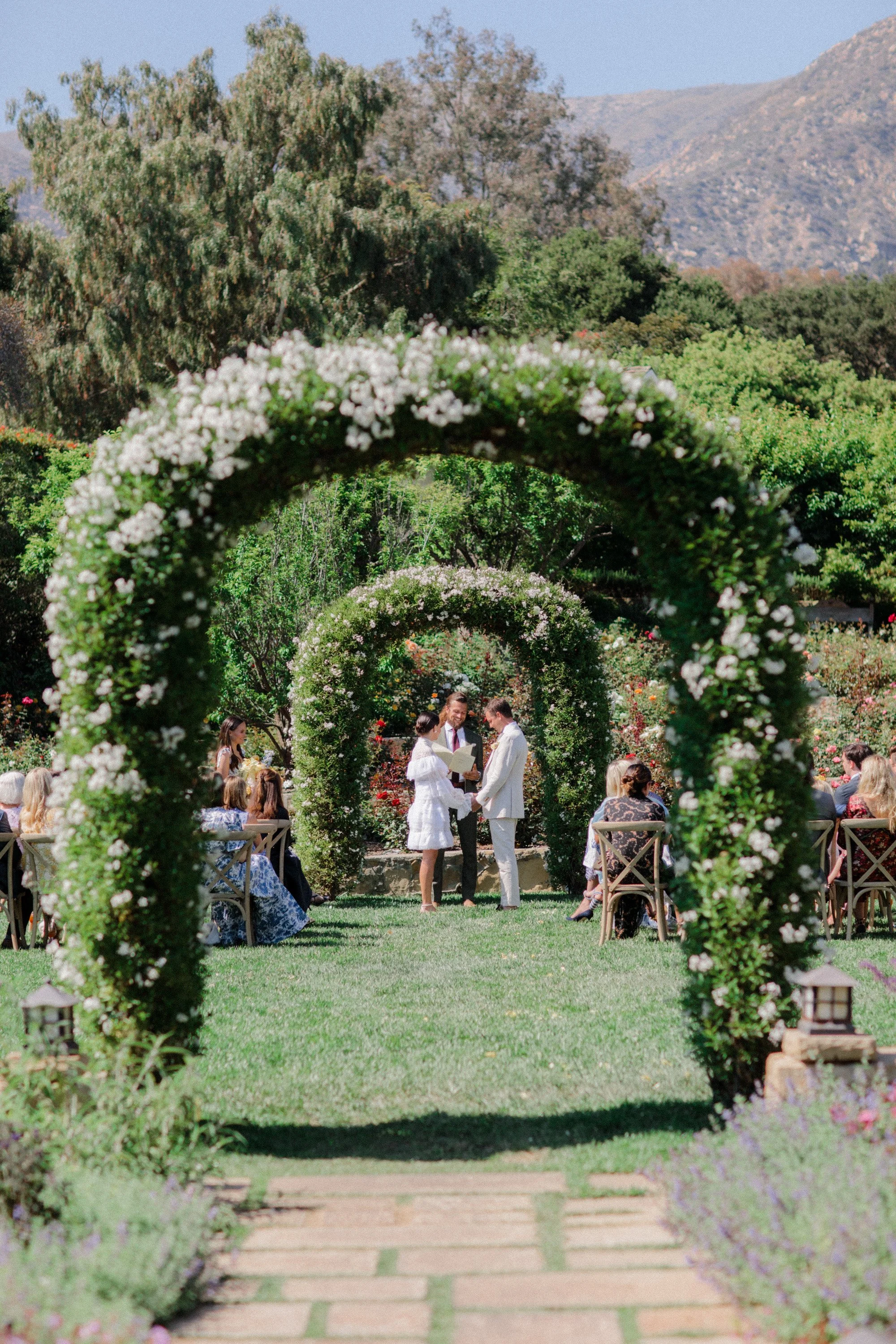 a floral archway photographed by Michael & Anna Costa
