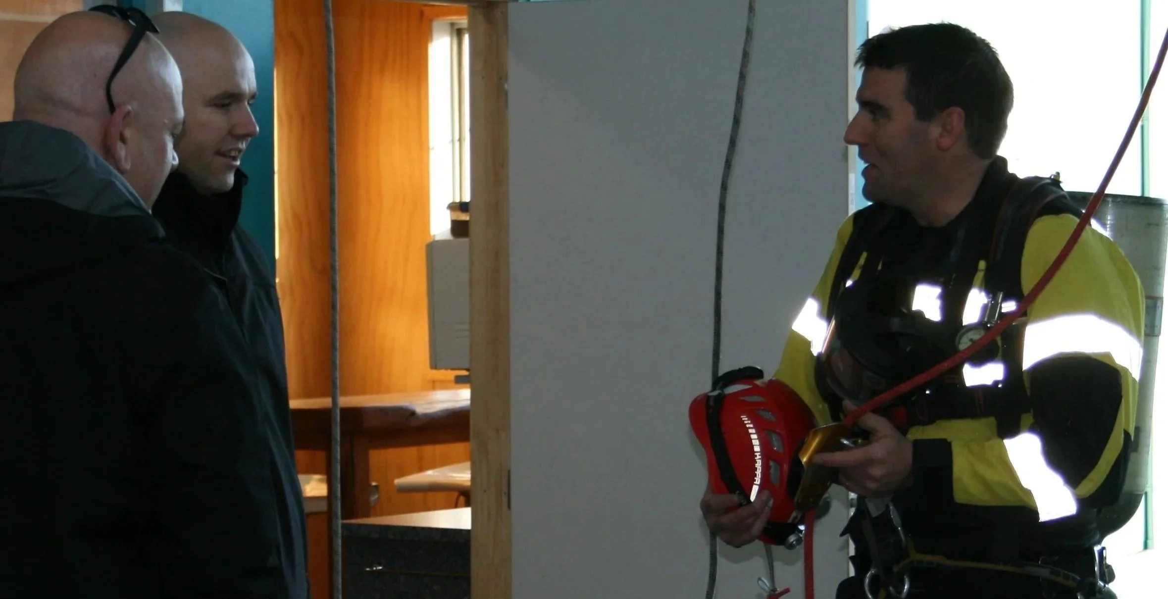 Troy, Elite Training's owner, demonstrating rope access in breathing apparatus (specialist work)