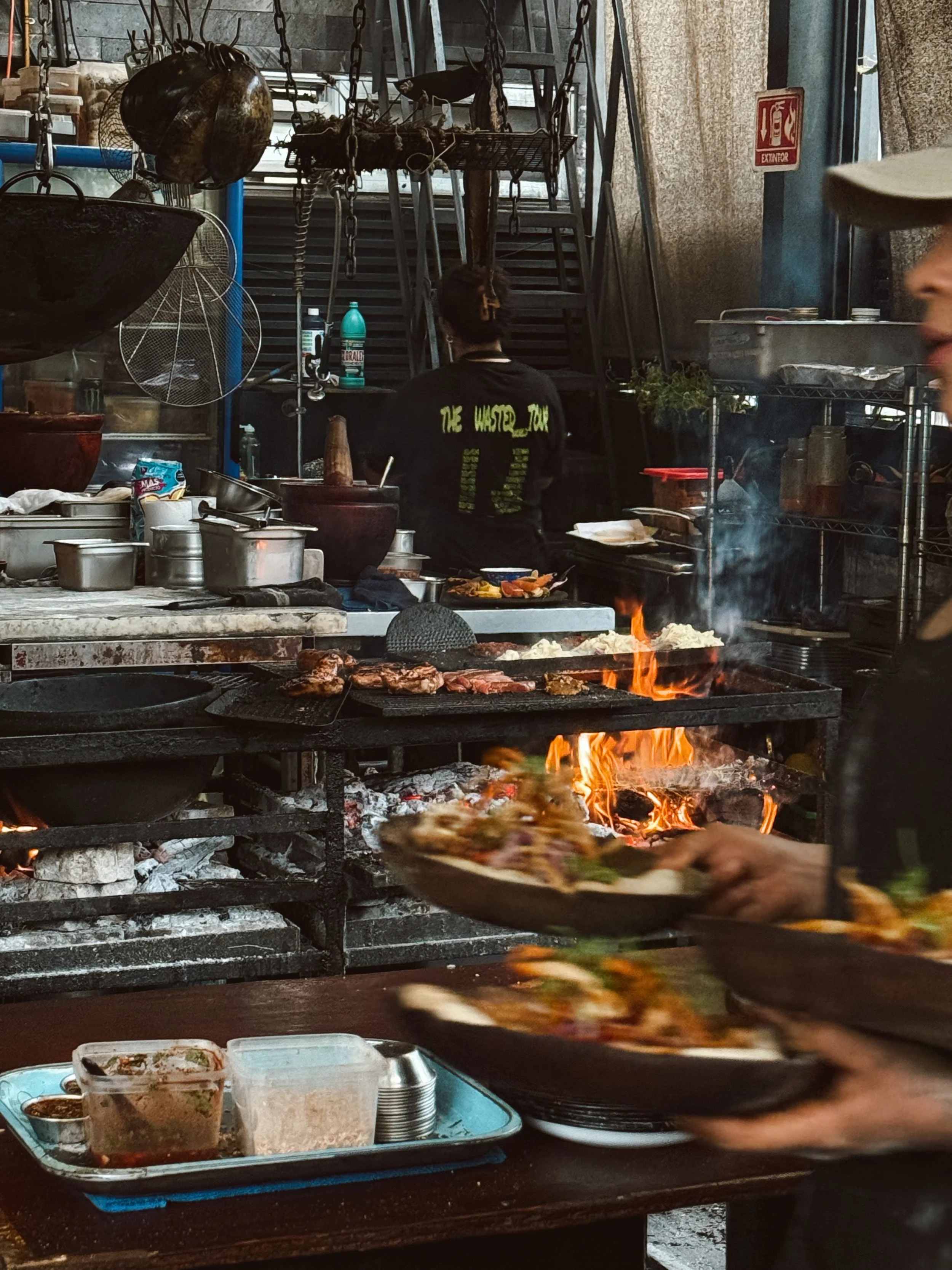 open fire cooking rooftop Thai food in Mexico City