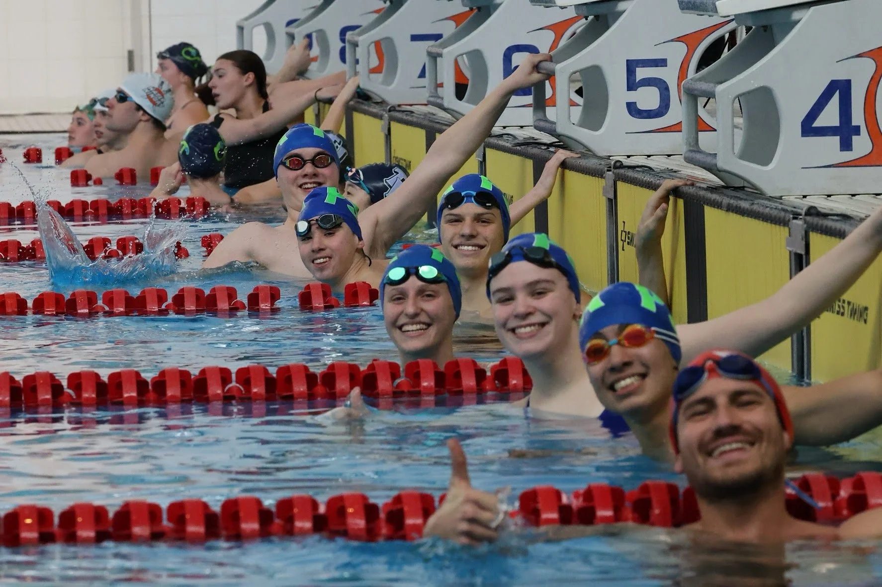 Senior pool lifesaving athletes together in the pool