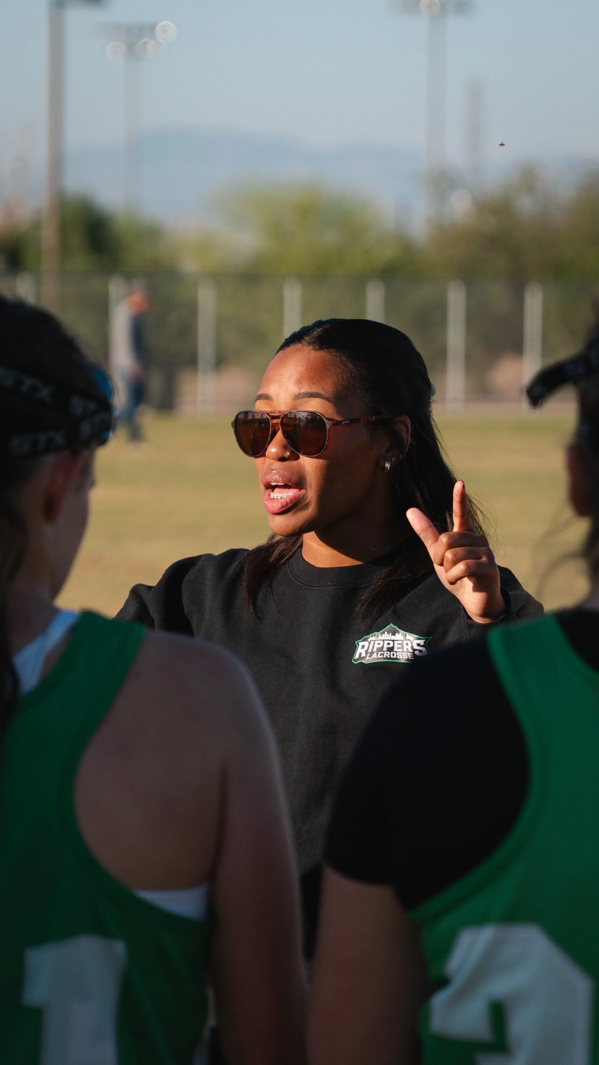 Coach Marena Tharpe with team in IWCLA Southwest Cup