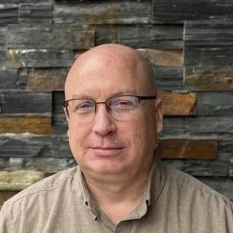 man in a tan shirt