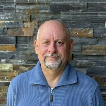 man in a blue shirt