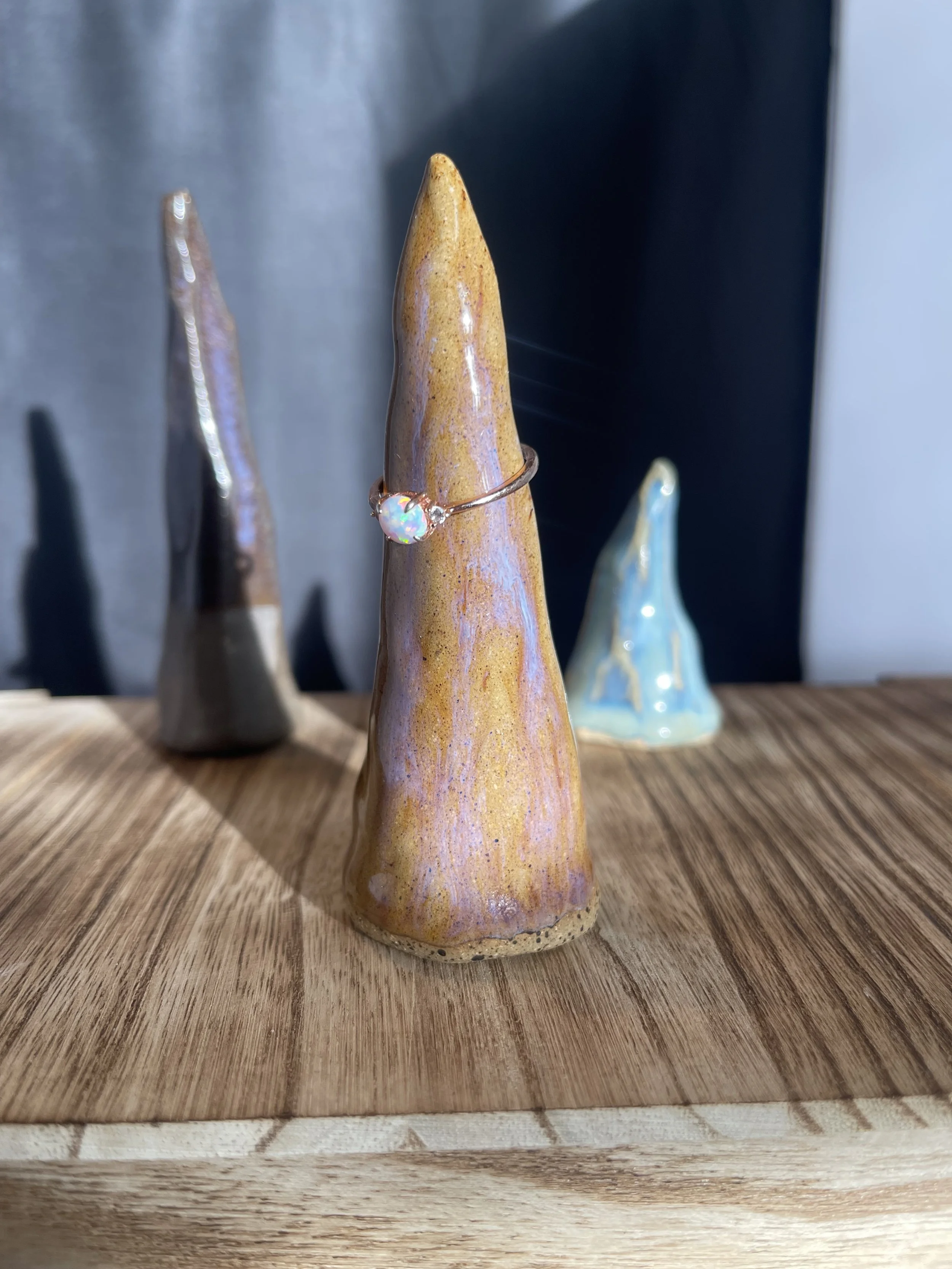 Handmade Ceramic Ring Holders | Mystical Cone Sculptures by Stray Cat Studios
Each handcrafted ring holder is a tiny sculptural spire—dripping in dreamy glazes and strange magic. A functional altar for your jewelry, crafted for the curious.