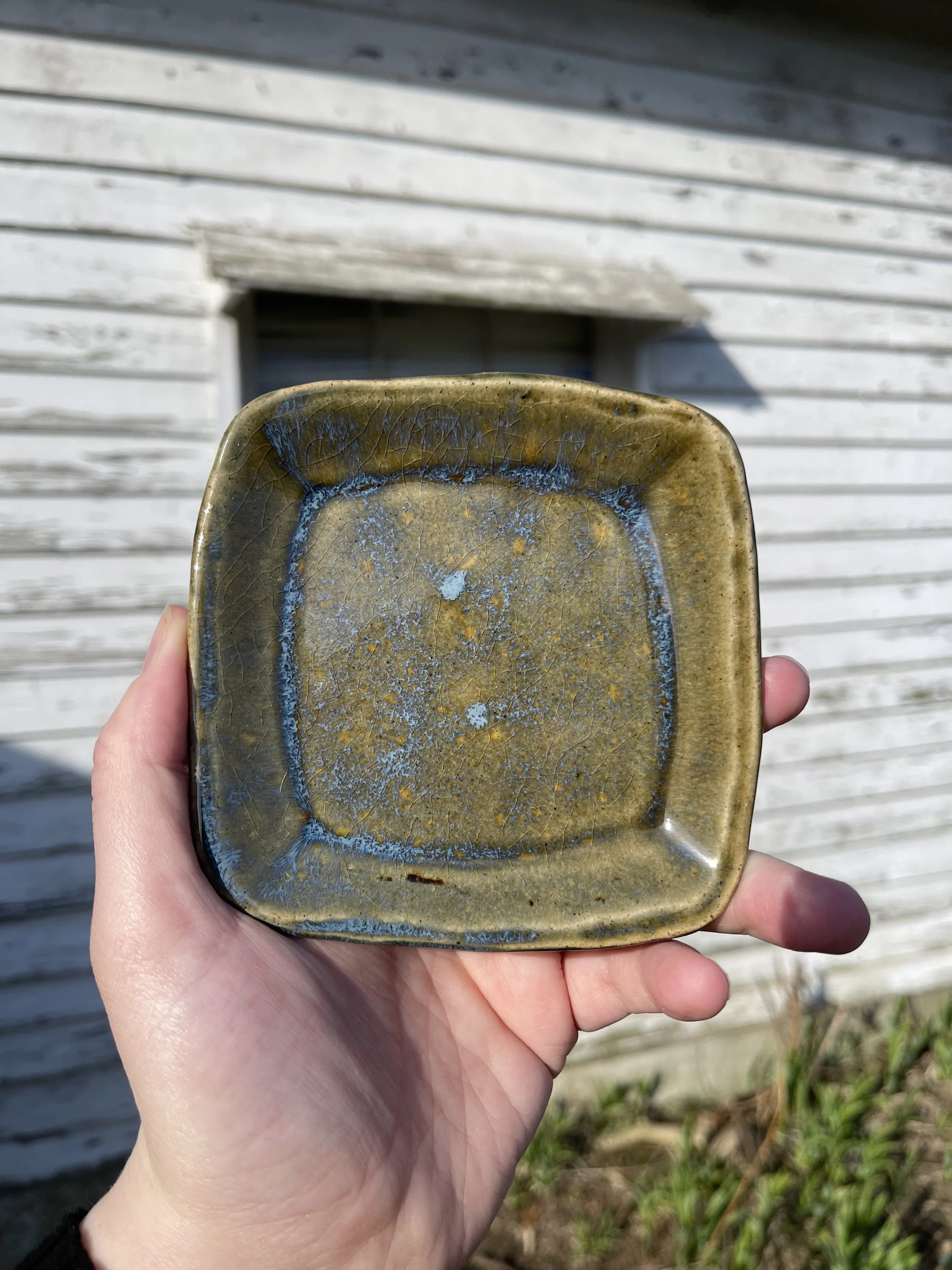 Small Square Ceramic Trinket Dish | Mossy Blue Crackle Glaze by Stray Cat Studios
This handmade square trinket dish features a mossy glaze with smoky blue crackle. Perfect for rings, keys, or enchanted pocket finds—crafted for the curious.