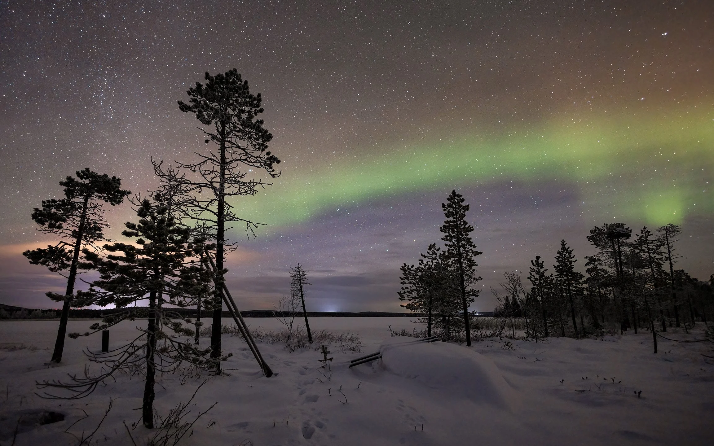Aurora Over a Frozen Lake in Finnish Lapland