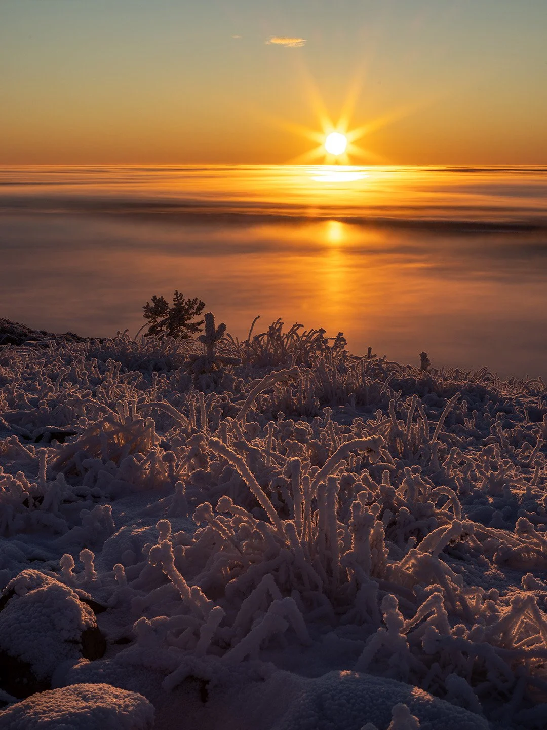 A spectacular sunset above the clouds in Finnish Lapland