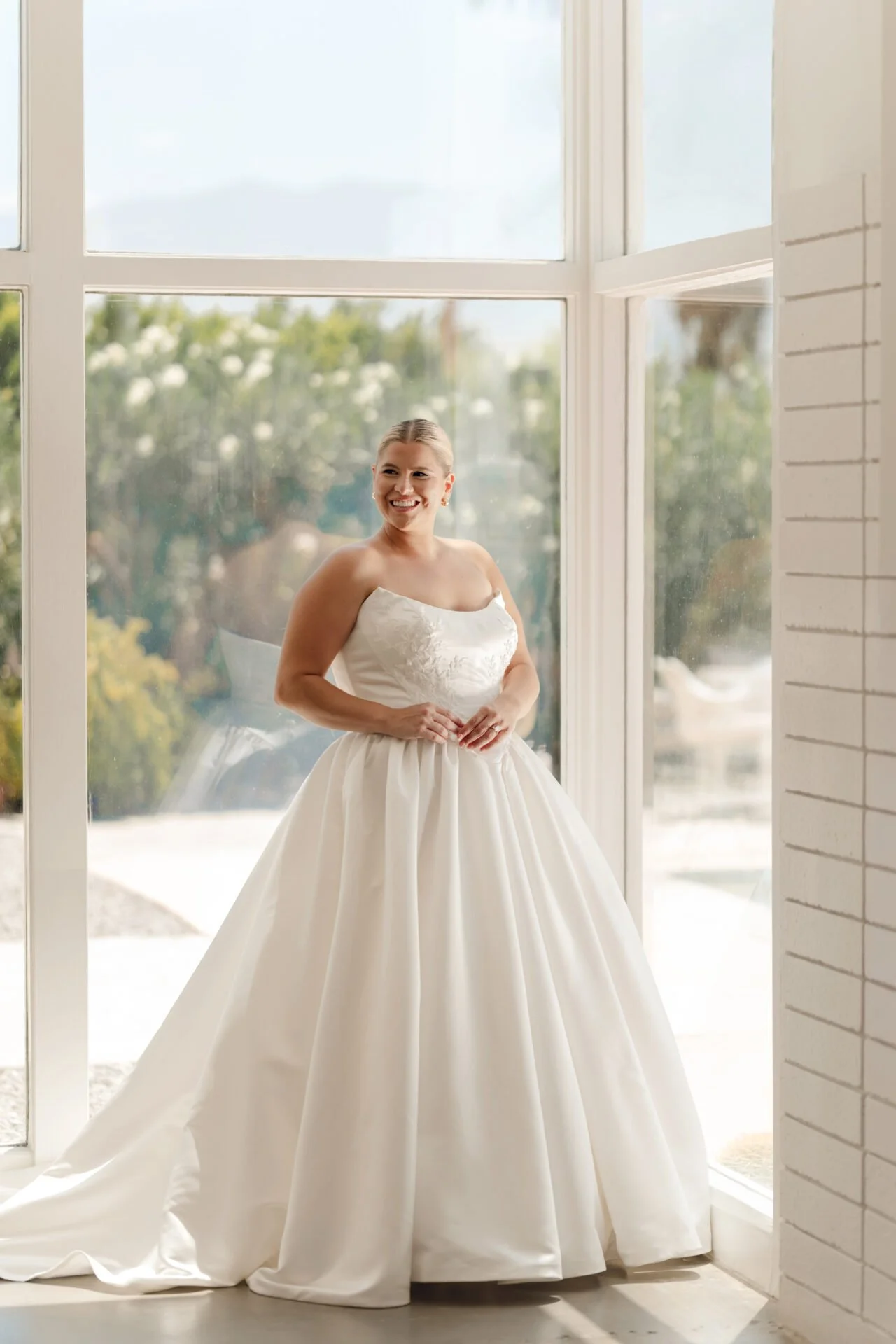 Satin Stella York ball gown with beading on the bodice, basque waist and swoop neck with cat eye points.