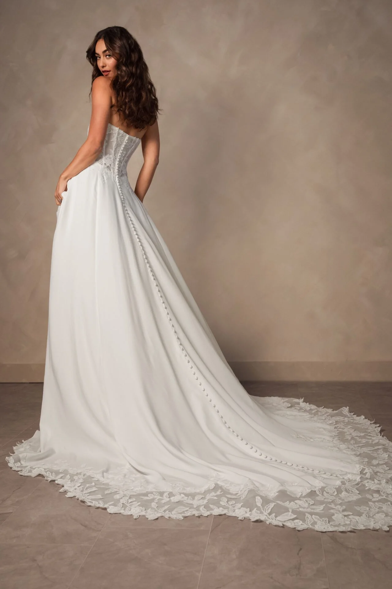 Crepe and lace minimalist Essense of Australia wedding dress with long lace train.