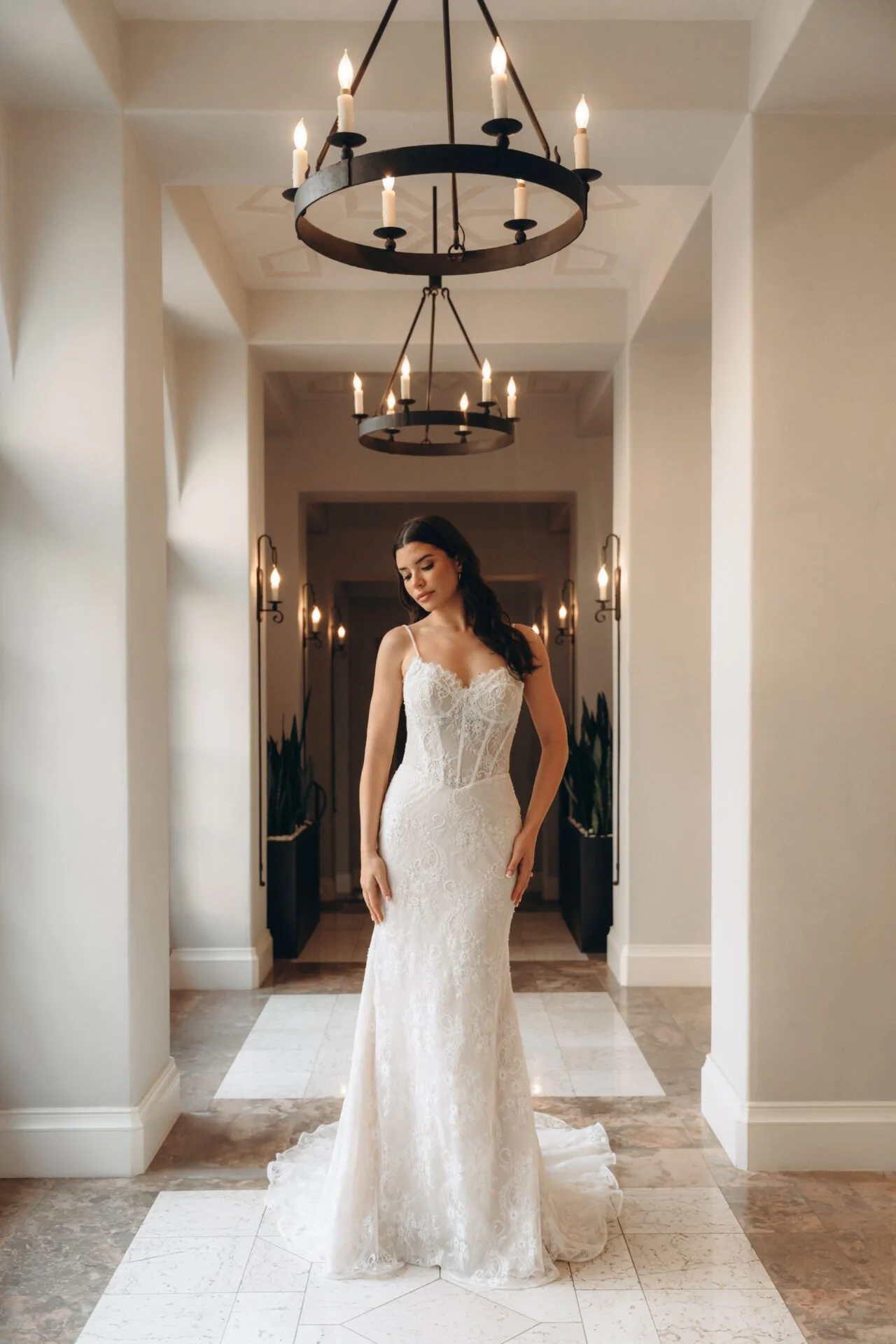 Fitted Stella York all-lace wedding dress with thin straps and sweetheart neckline. Corset looking bodice with exposed boning and basque waist.