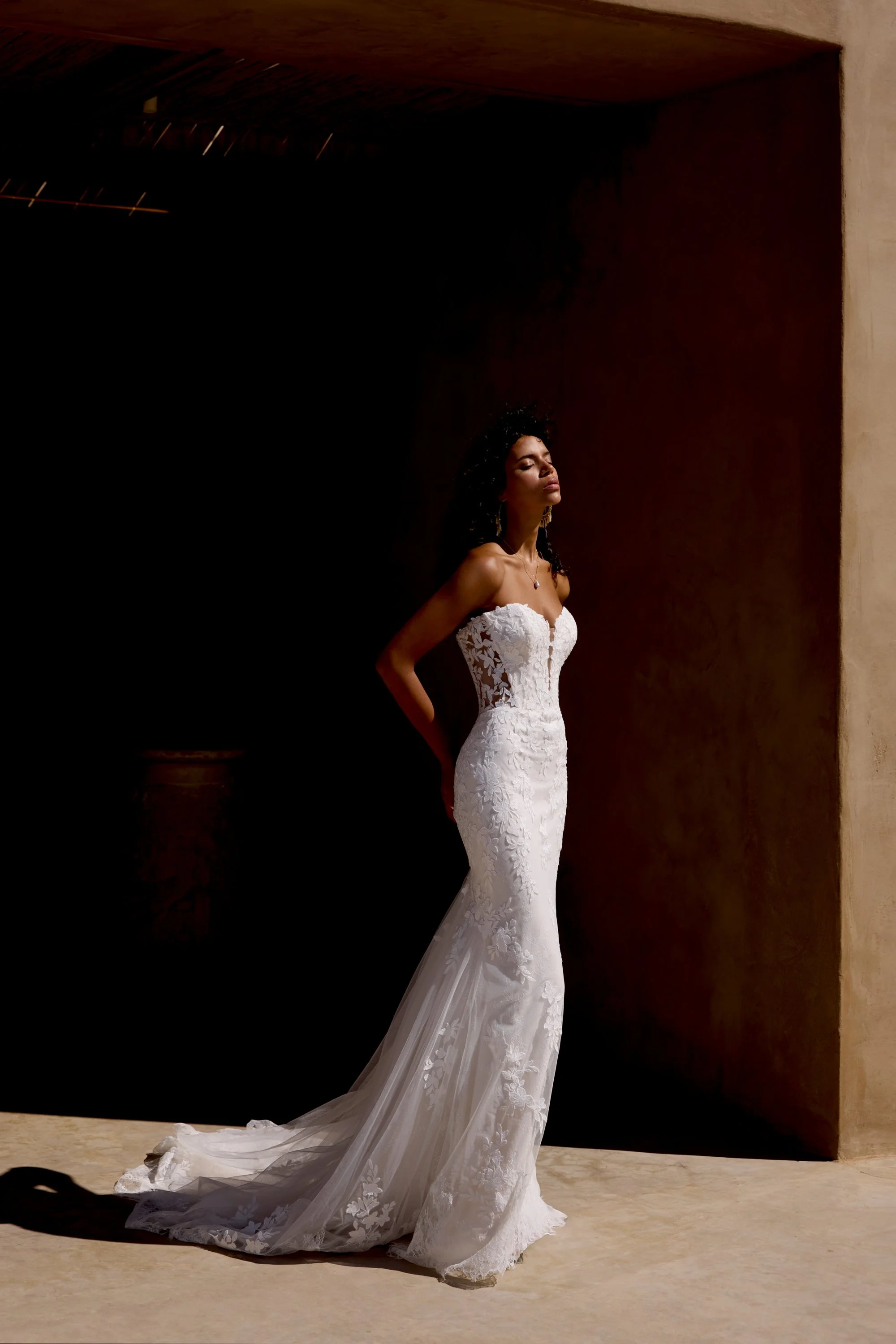 Fit-and-flare lace and tulle ivory wedding dress by Lillian West