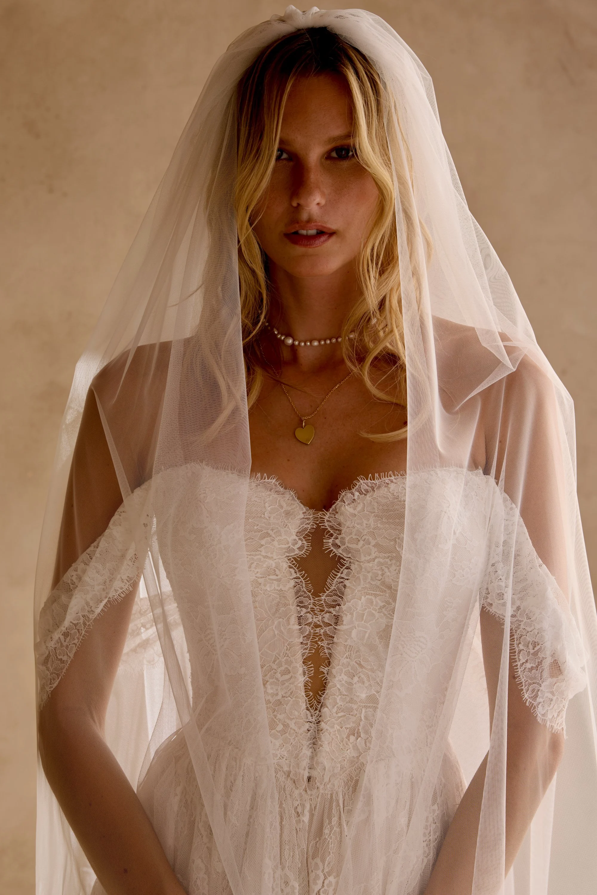 All lace dress by Lillian West with vintage lace pattern, drop shoulder sleeves and plunging neckline