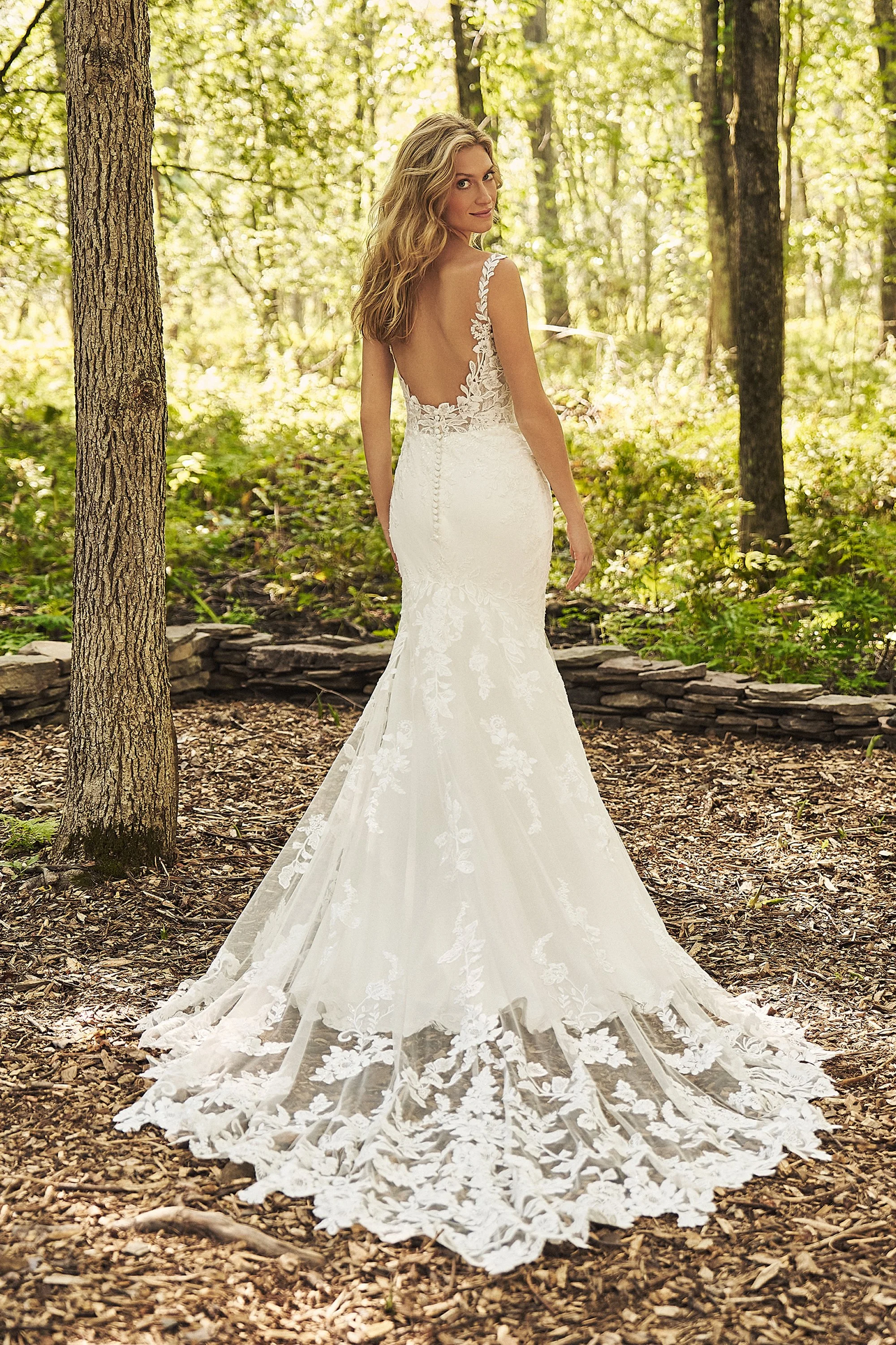 Lace and crepe fitted Lillian West wedding dress. Thick lace straps. Long lace train.