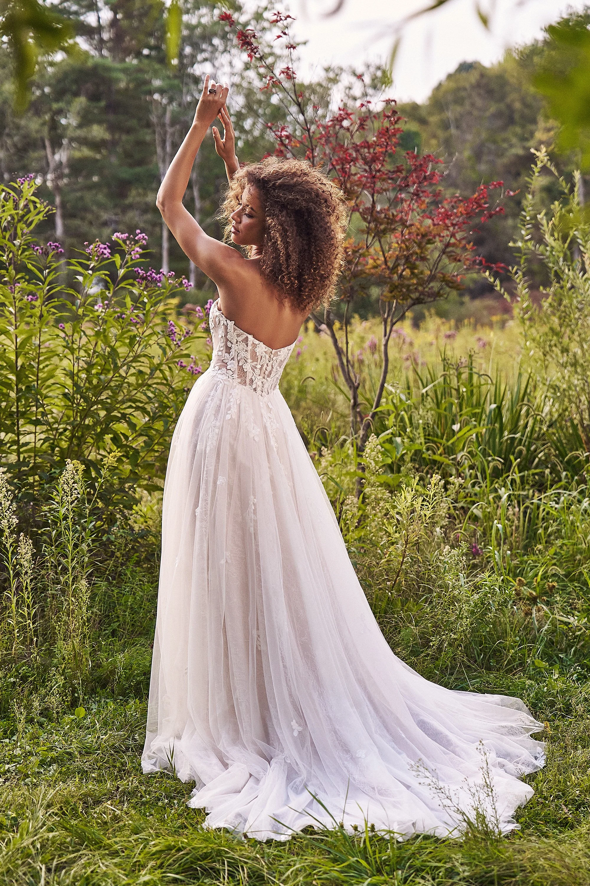 Lillian West tulle and lace wedding dress with sheer bodice and double lace skirt with chantilly lace layer and floral applique layer.