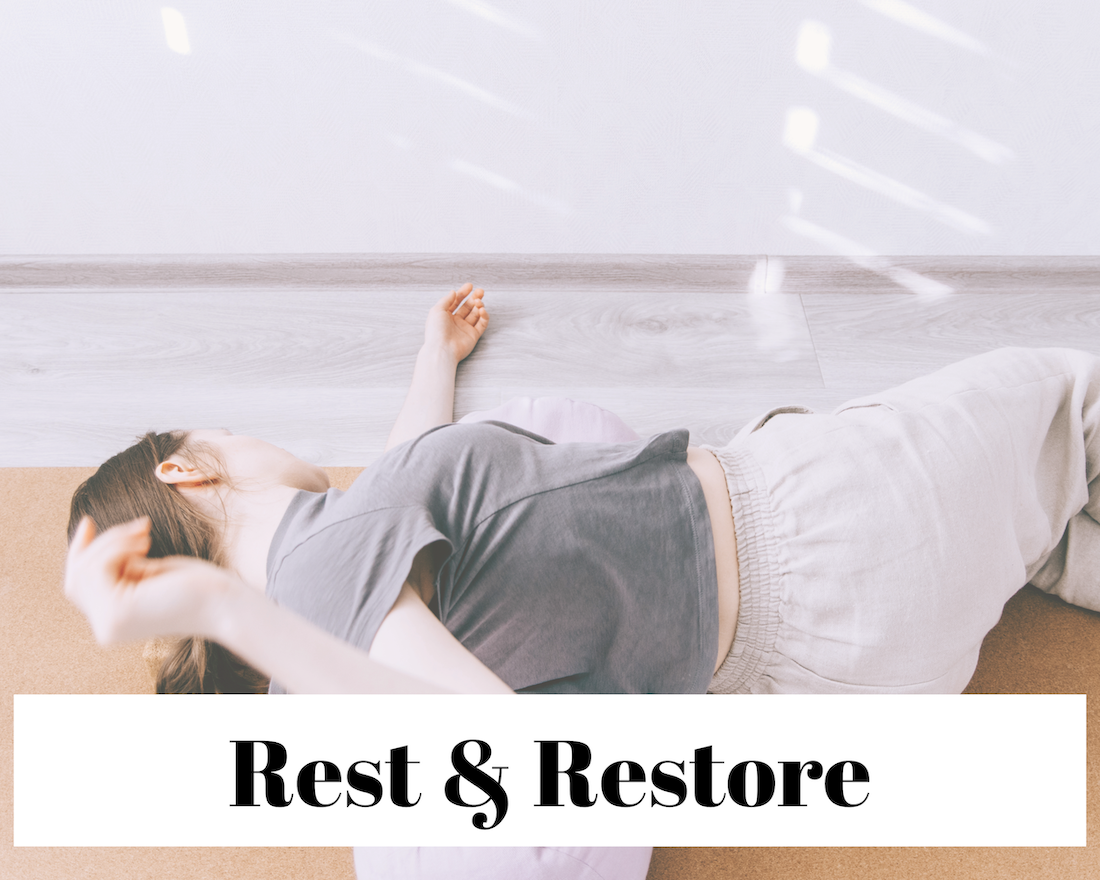 A person lying on the floor, doing Yin Yoga, with the text 'Rest & Restore'