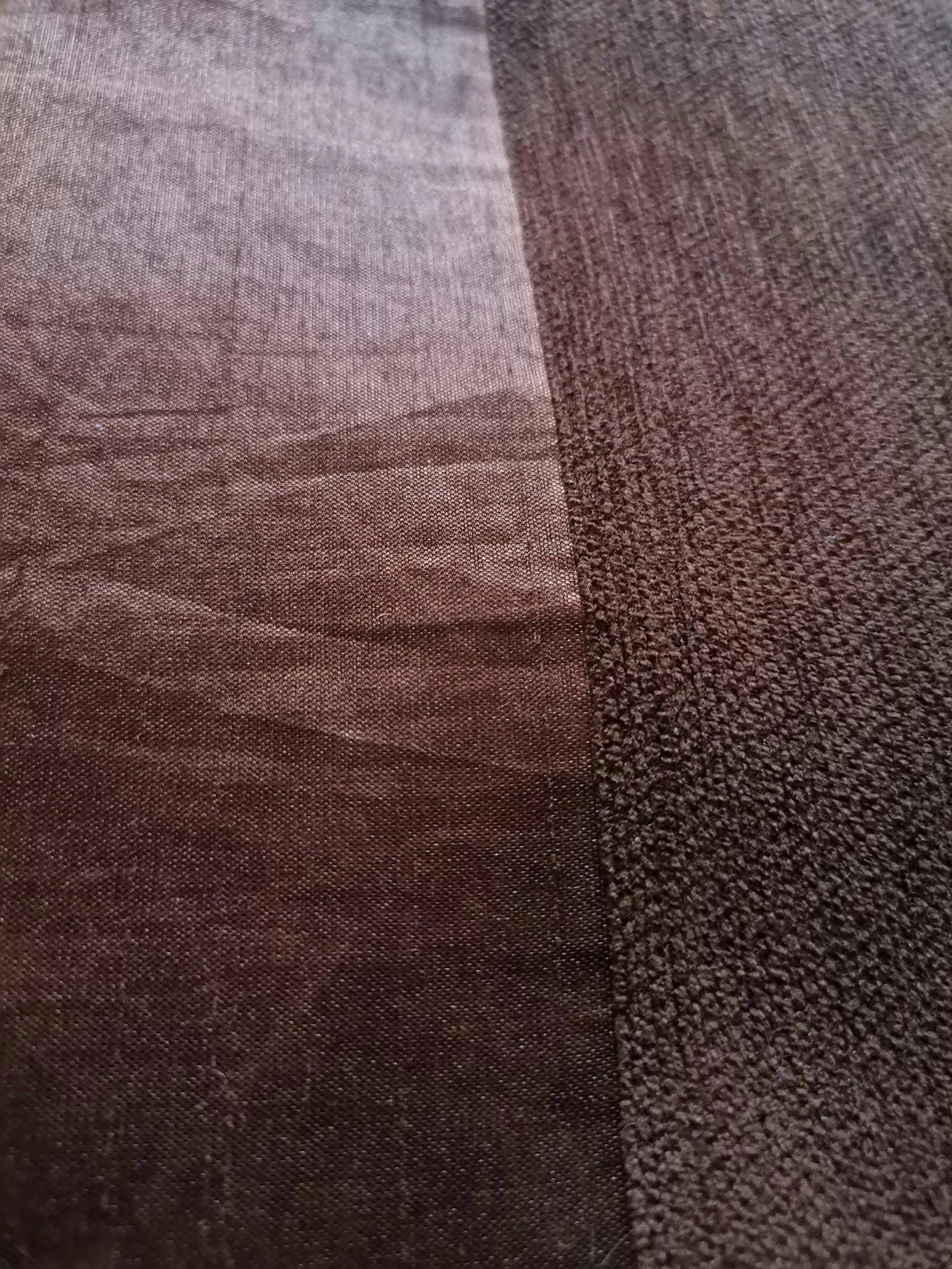 Close view of textured fabric with stitched pattern