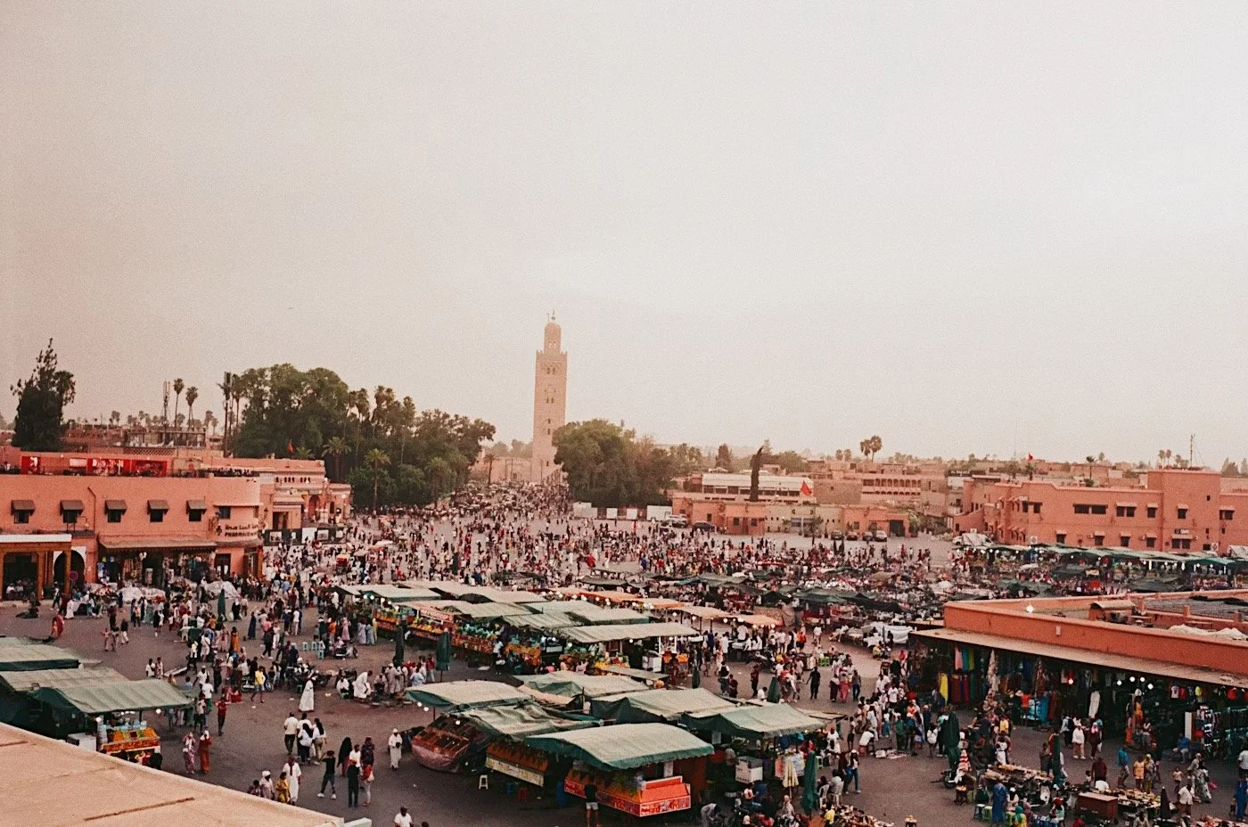Koutoubia minaret silhouetted against a golden sunset sky in Marrakech, Morocco
