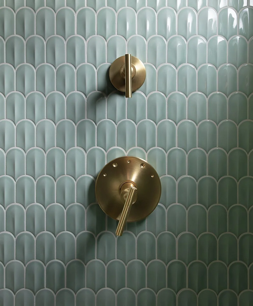 Fishscale tile and brass fixtures