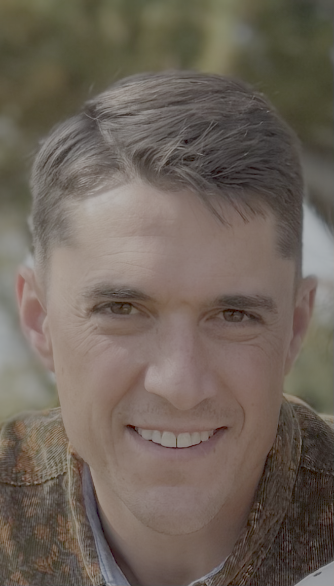 Close-up of Greg Norris smiling, the founder of Capstone Property Management.