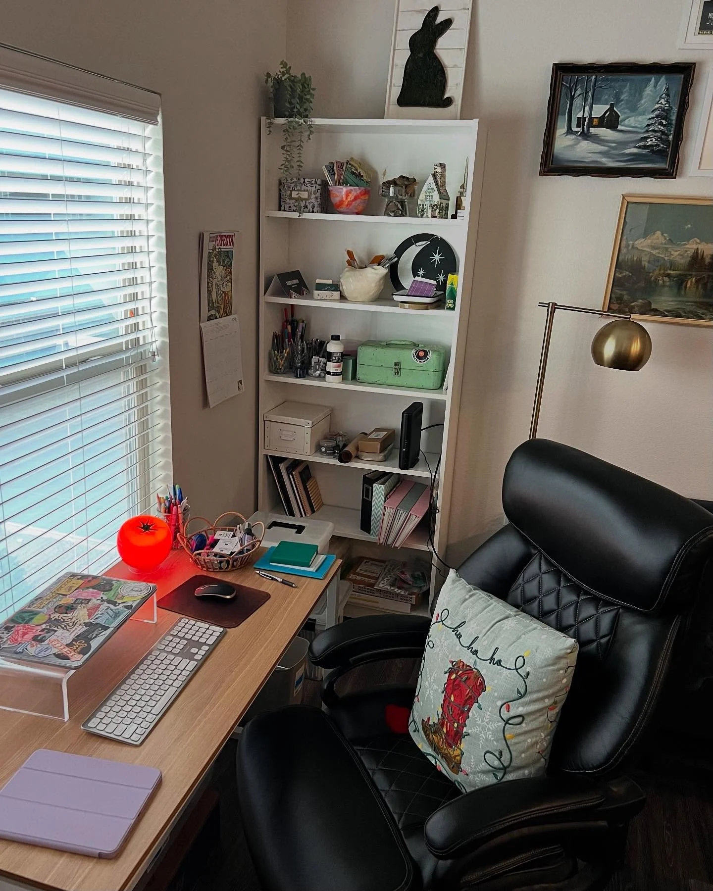 Current desk setup! 👩🏻&zwj;💻🧑🏻&zwj;🎨 My favorite parts are my tomato lamp, seashell paint brush holder, and the wooden Christmas house painted by my nana ❤️

#graphicdesigner #branddesigner #desksetup #desk #artist