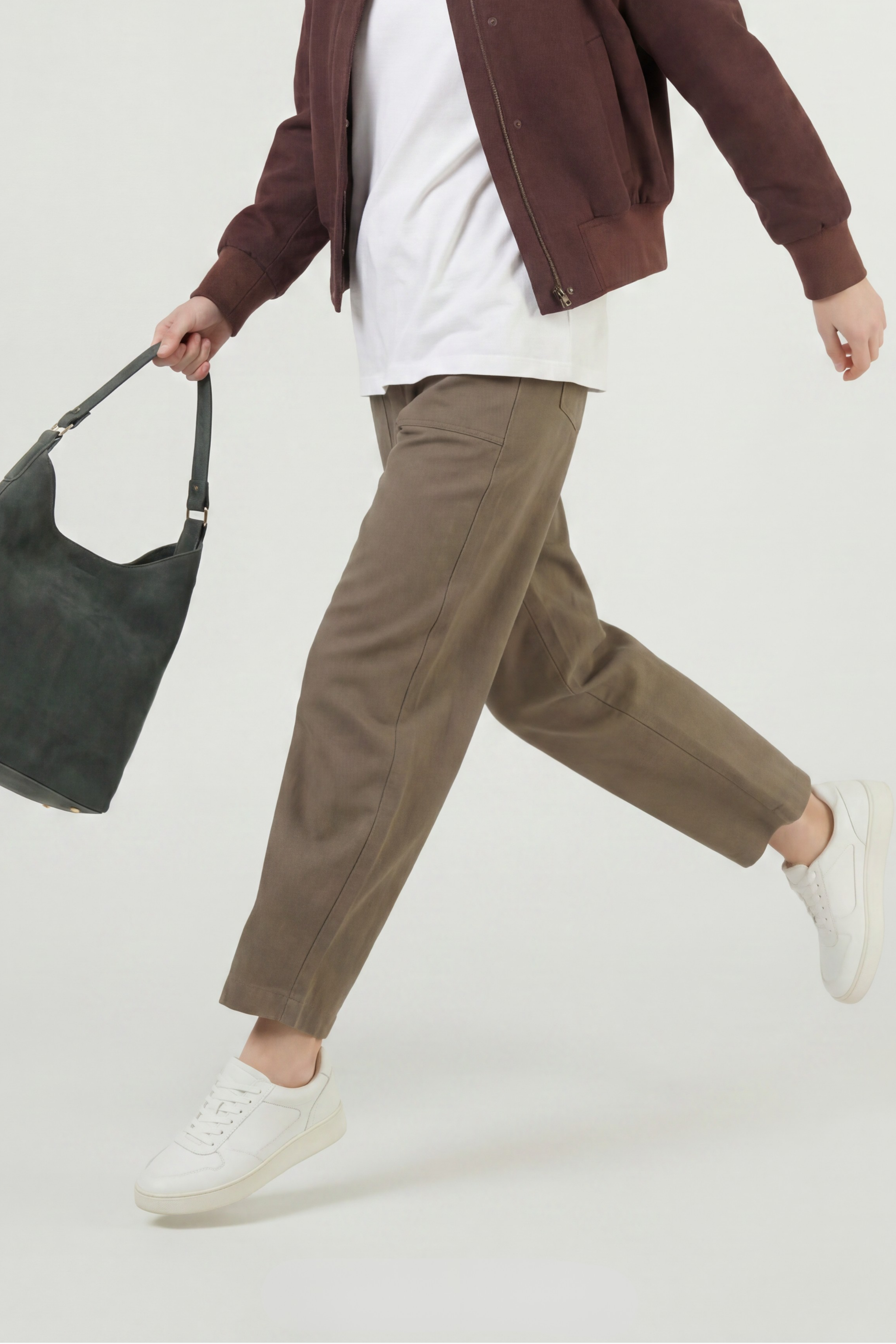 Model in motion wearing the olive twill pant