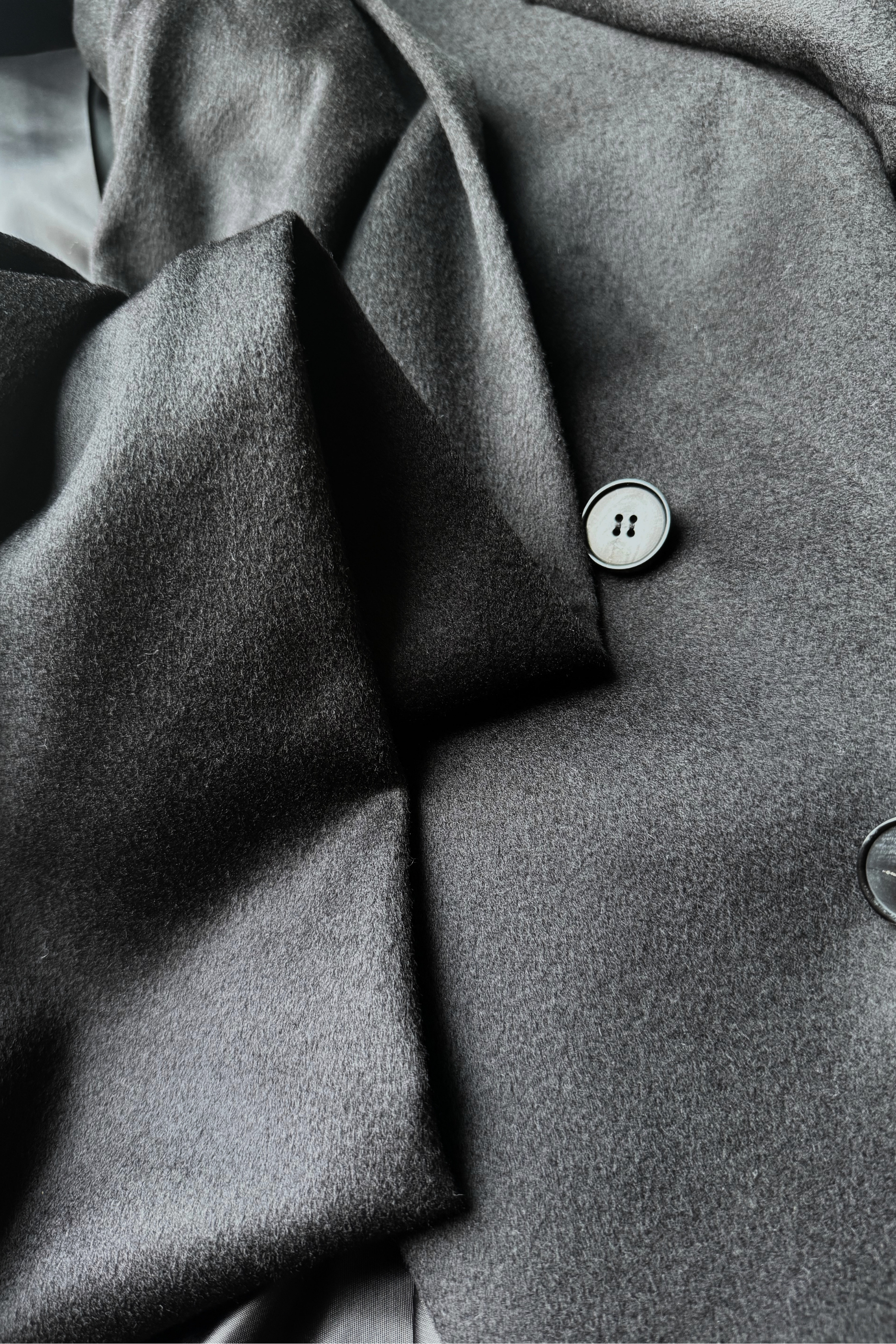 Closeup fabric image of the black wool/cashmere