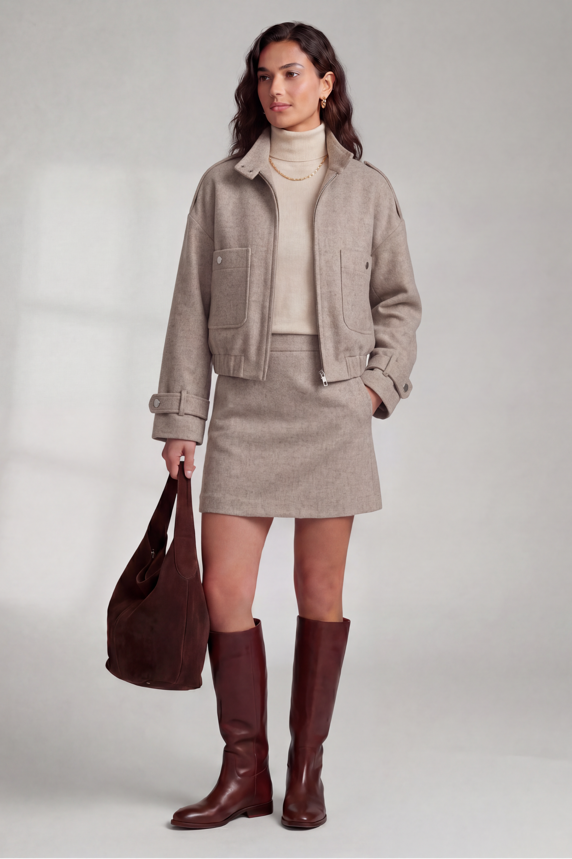 Front view of model wearing the Izzy Bomber, Izzy Skirt and Cashmere Turtleneck