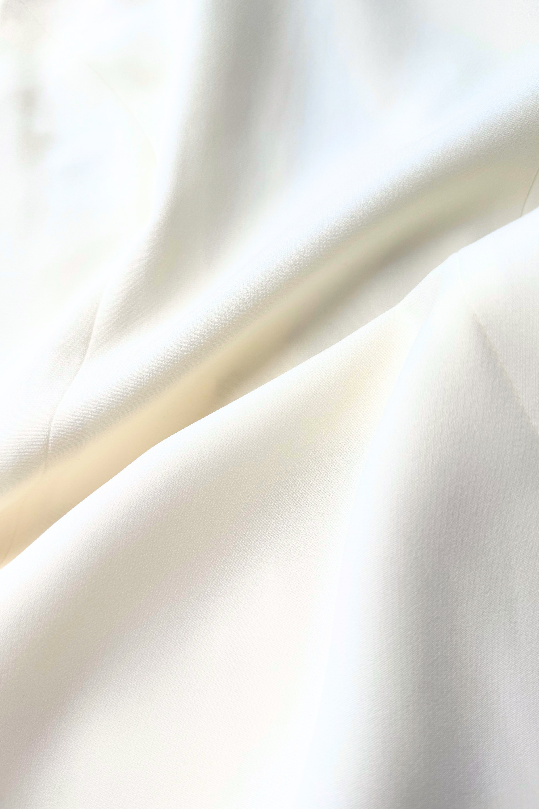 Closeup shot of Cream Crepe de Chine fabric