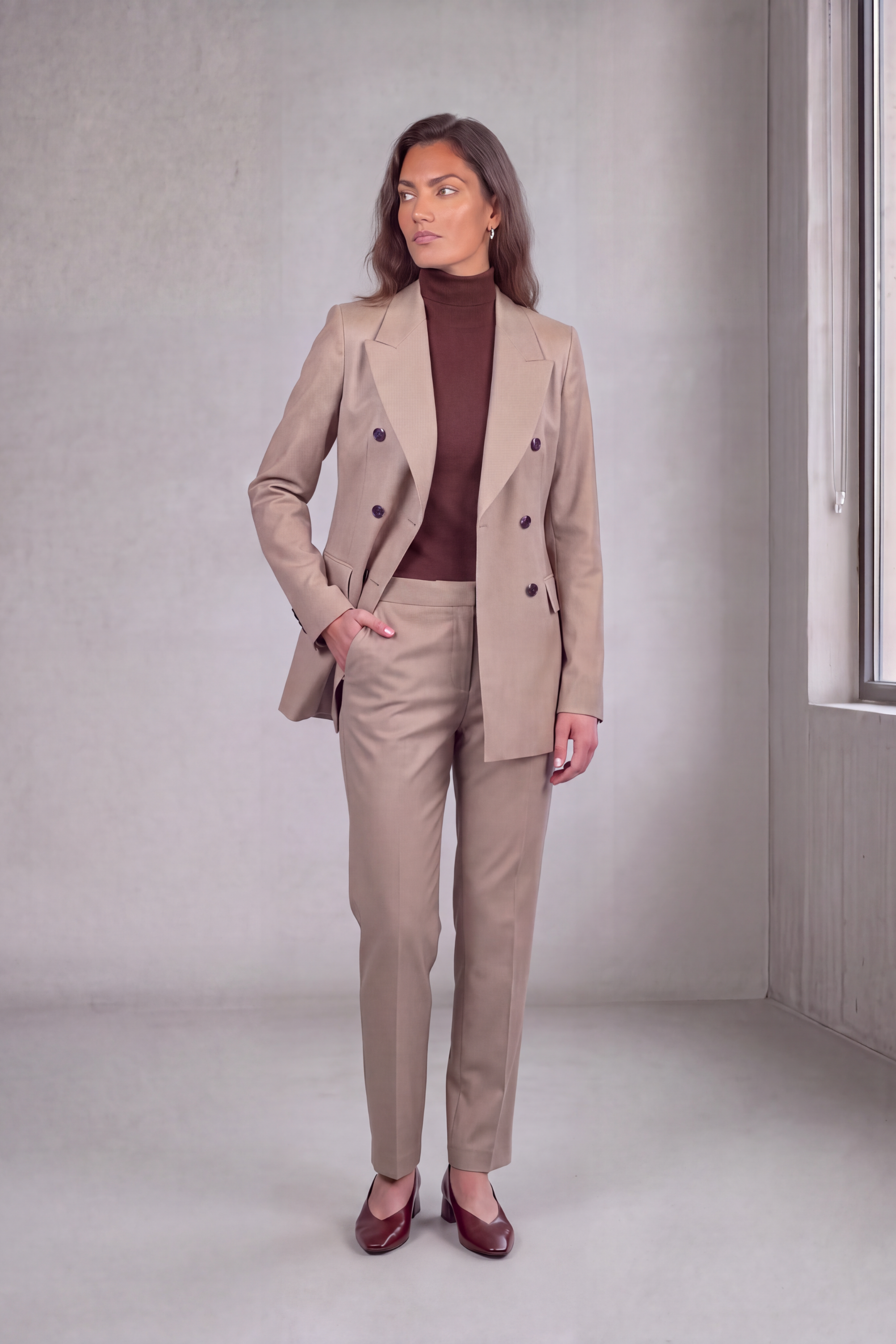 Full view of tan stretch cotton suit on a model