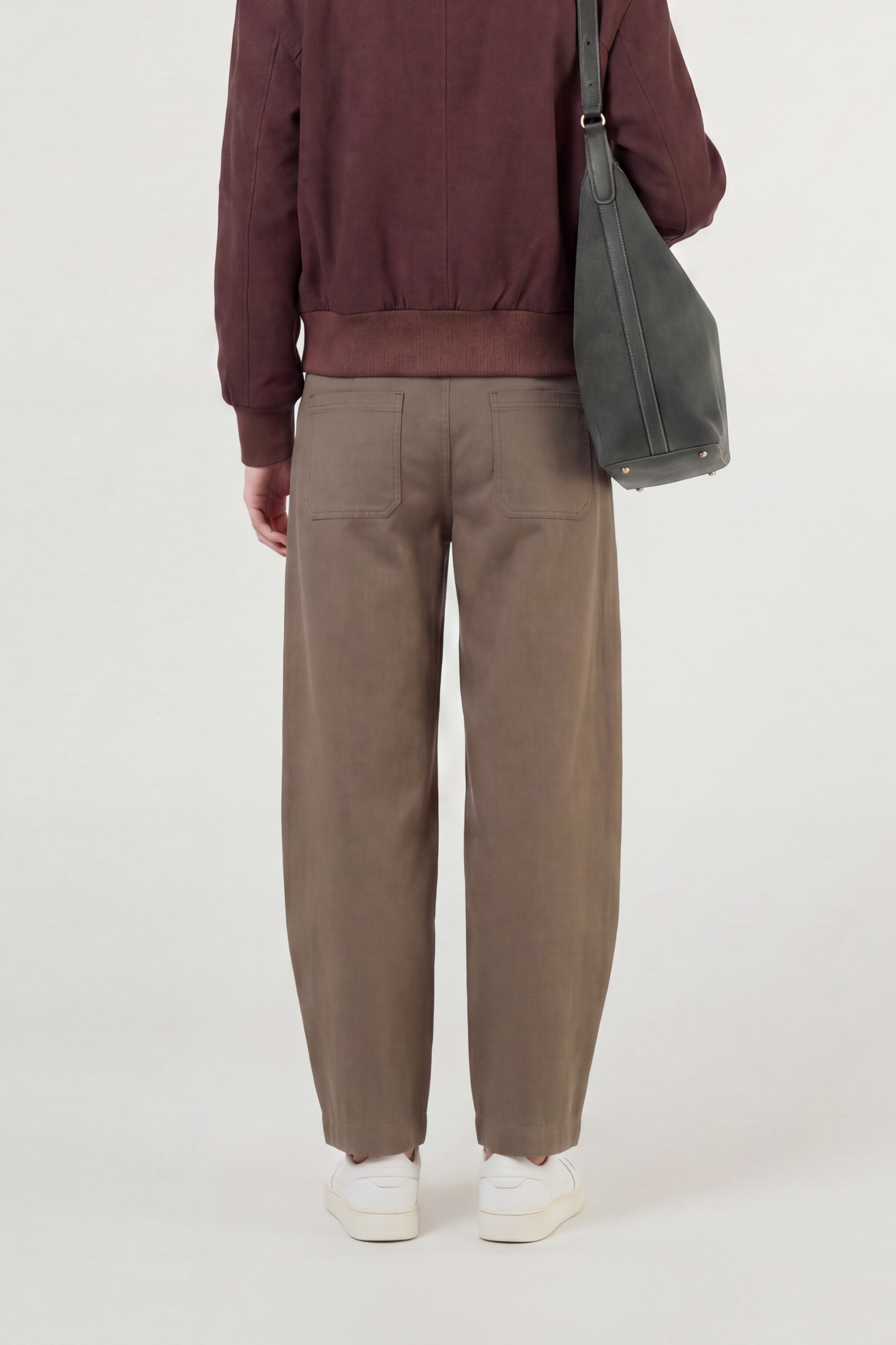 Back image of model wearing the utilitarian style olive pant