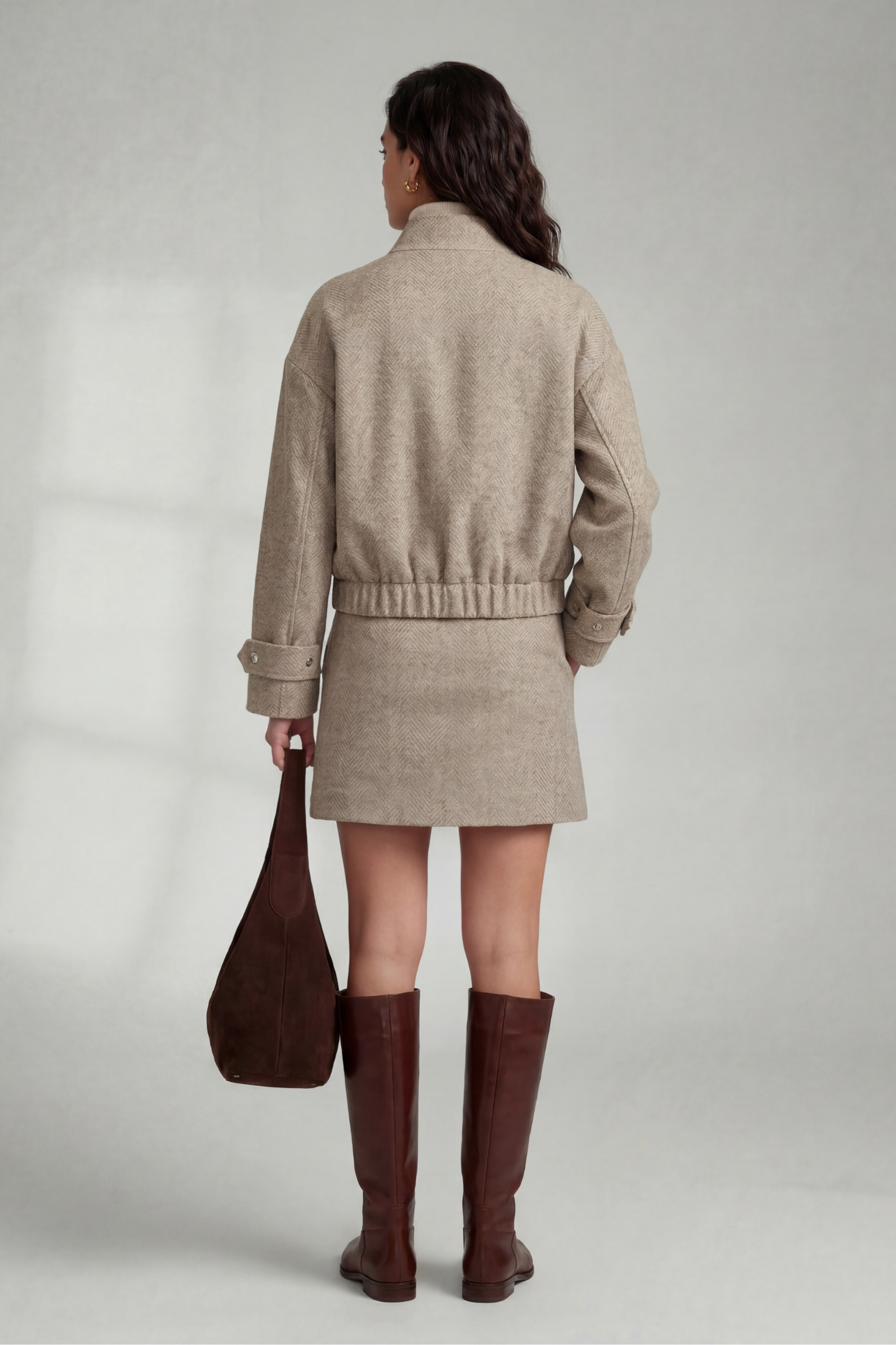 Back view of model wearing the Izzy Bomber, Izzy Skirt