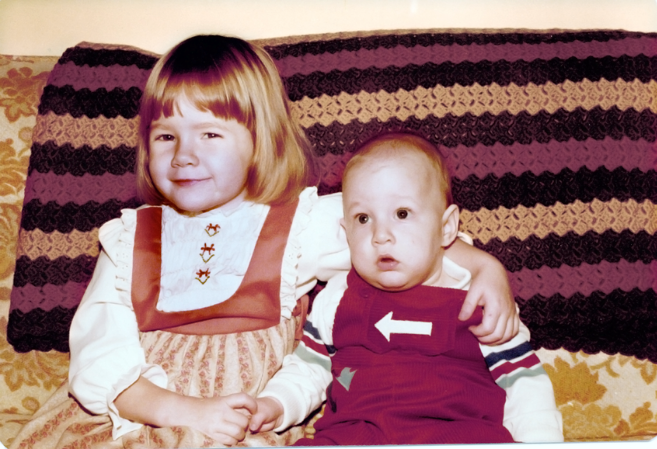 Laura Sams and Robert Sams as little kids on their grandmother's couch.