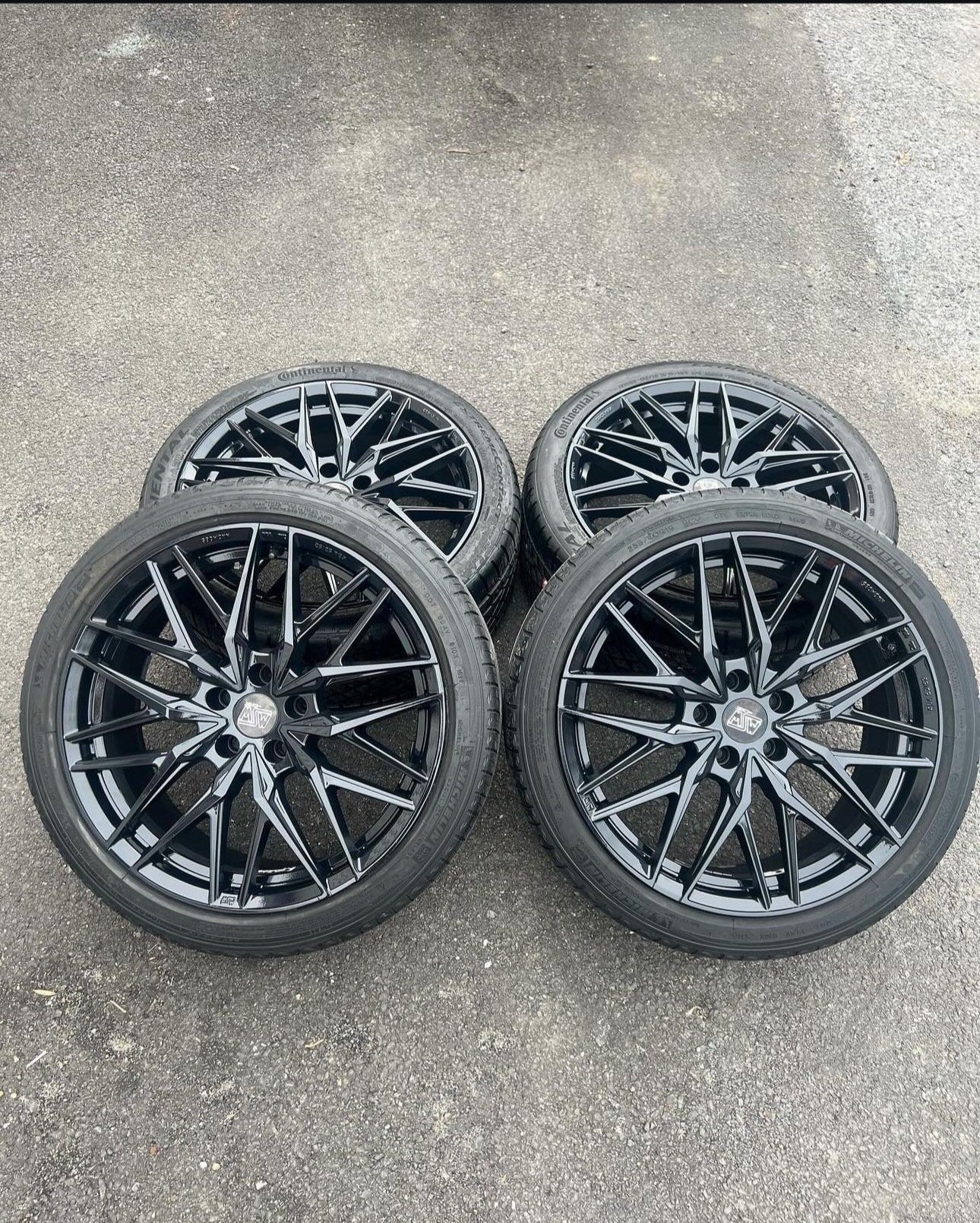 four wheels displaying custom wrap wheel painting