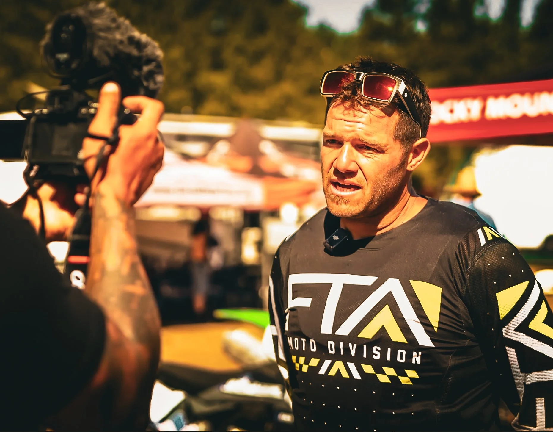 PM Productions filming an on-location interview with a MotoDemption instructor at a live event.