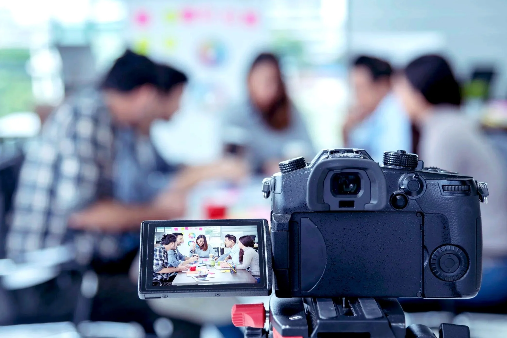 Professional video production planning session with camera setup during a collaborative brand shoot