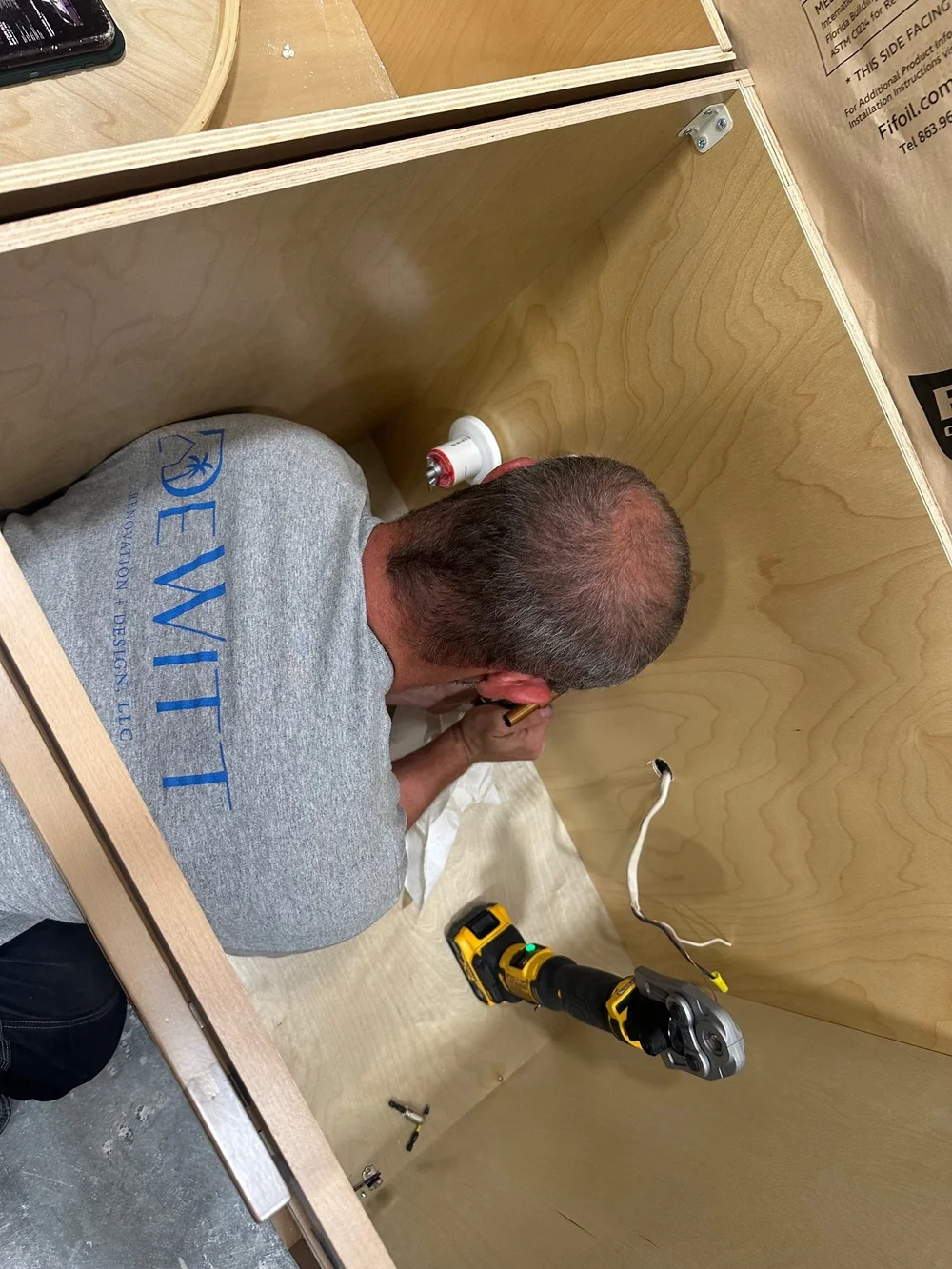 In Progress: DeWitt crew installing two-tone cabinetry - Fort Myers FL