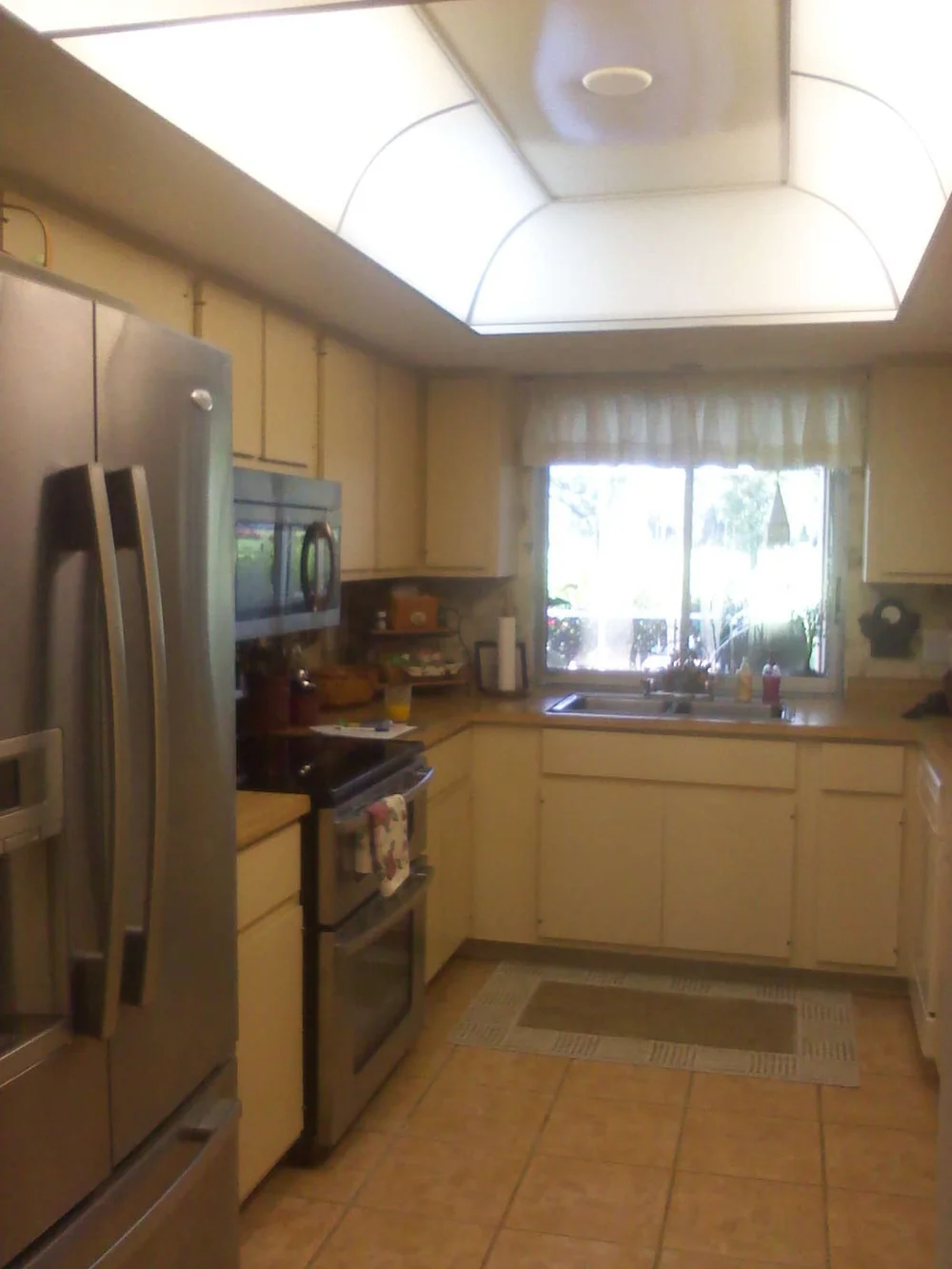 Before: Dated kitchen with fluorescent box lighting - McGregor, Fort Myers FL