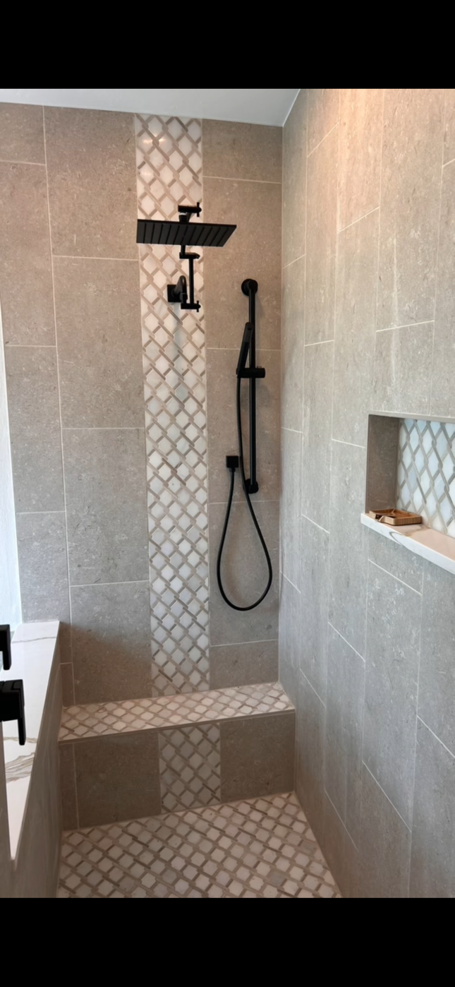 Walk-in tiled shower with mosaic accent and niche - Vanderbilt Lakes, Bonita Springs FL