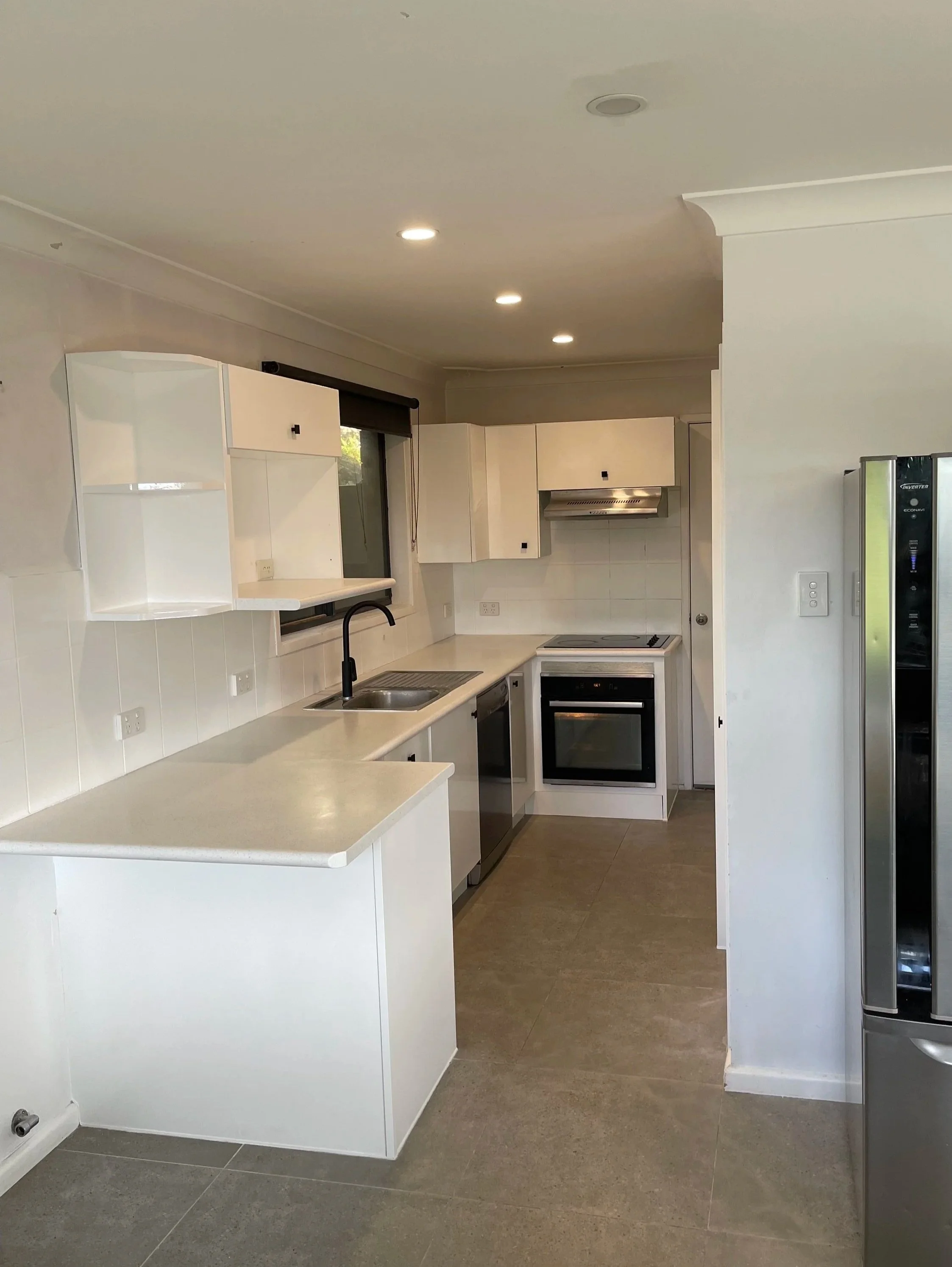 freshly resurfaced kitchen by SDR Renovations