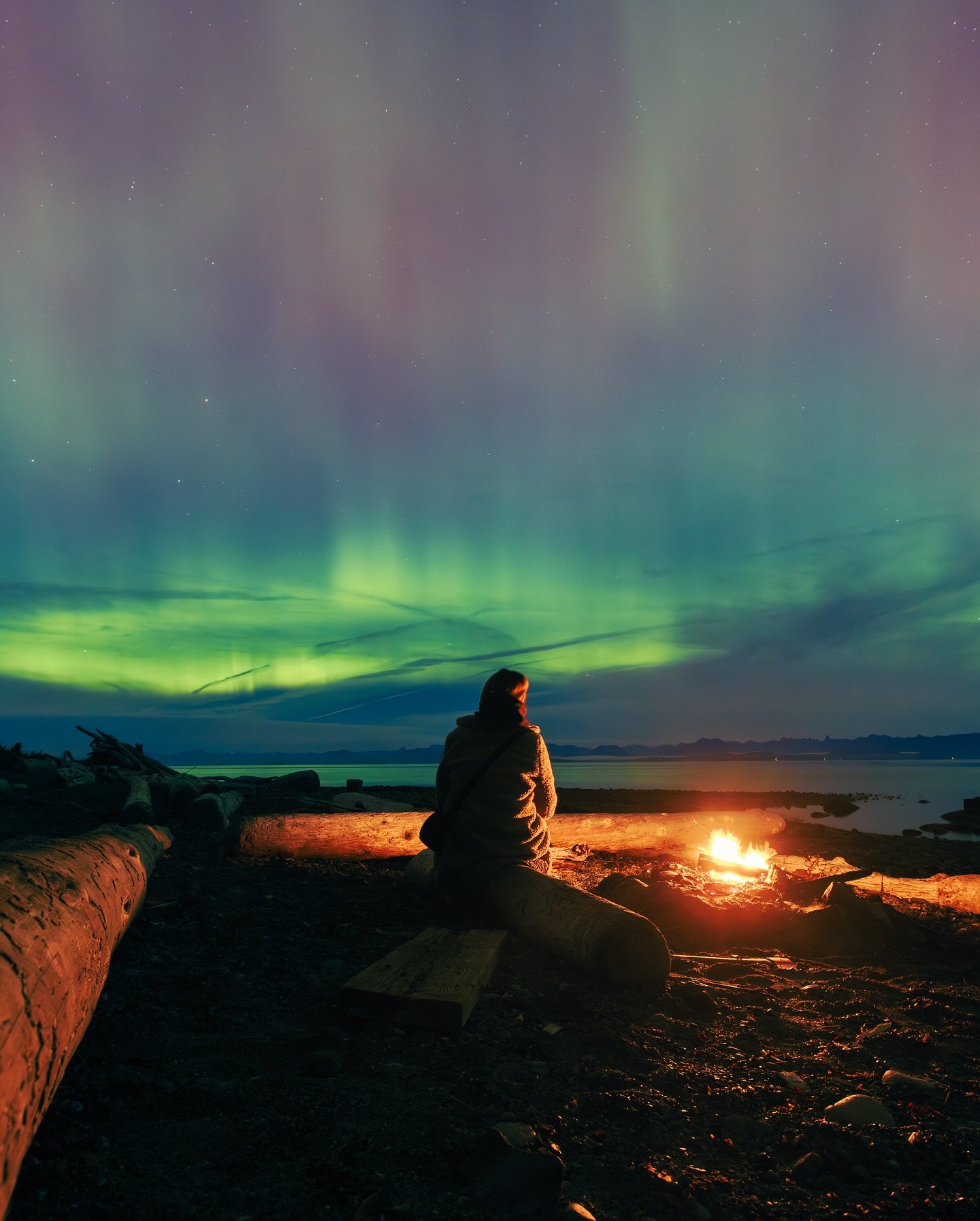 As I eagerly awaited for dusk to settle in, humpback whales began breaching while the sun dipped behind the mountains, setting the stage for a night of pure delight. 

This was my first time witnessing the aurora borealis and although much fainter to