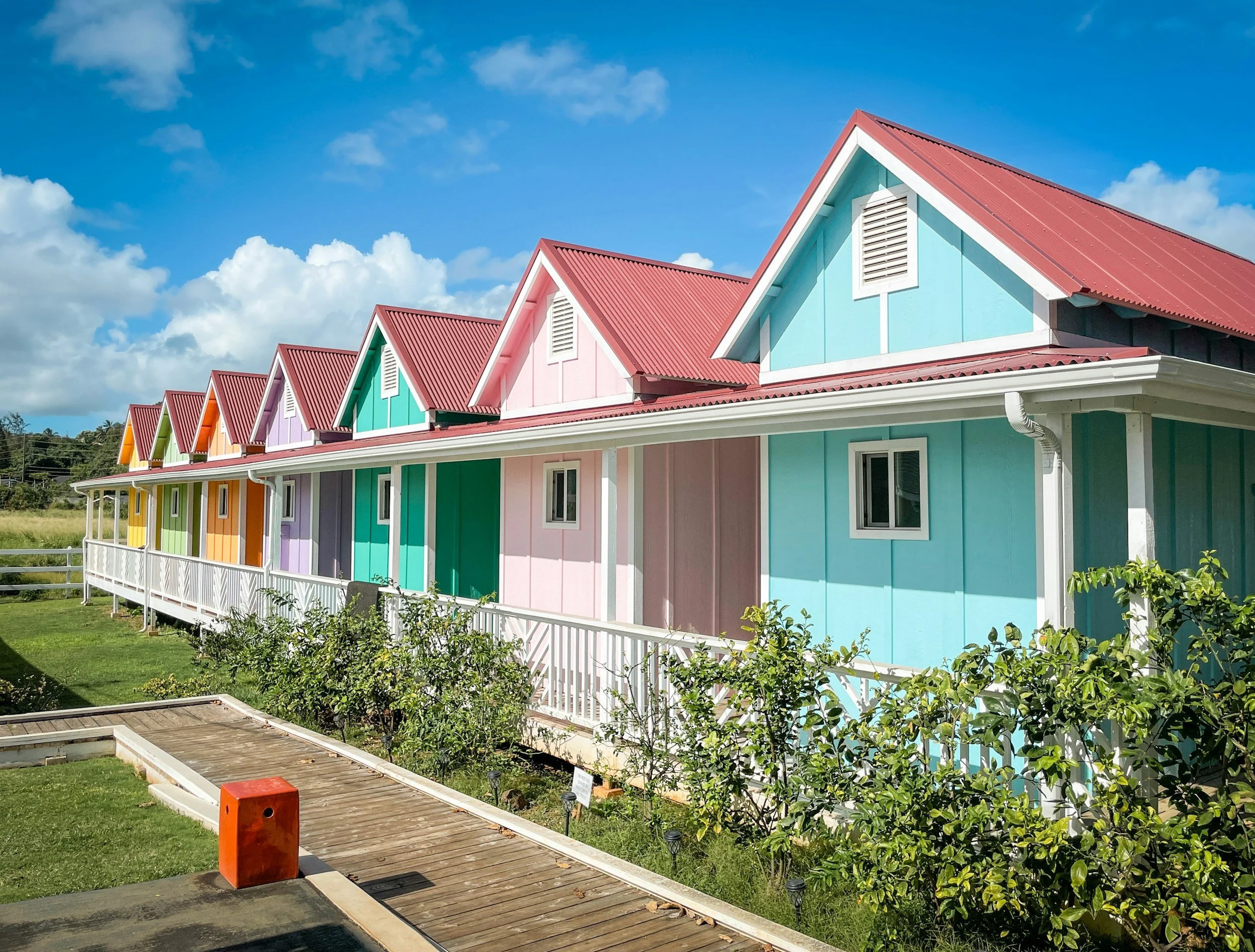 A row of colorful tiny homes in pastel colors