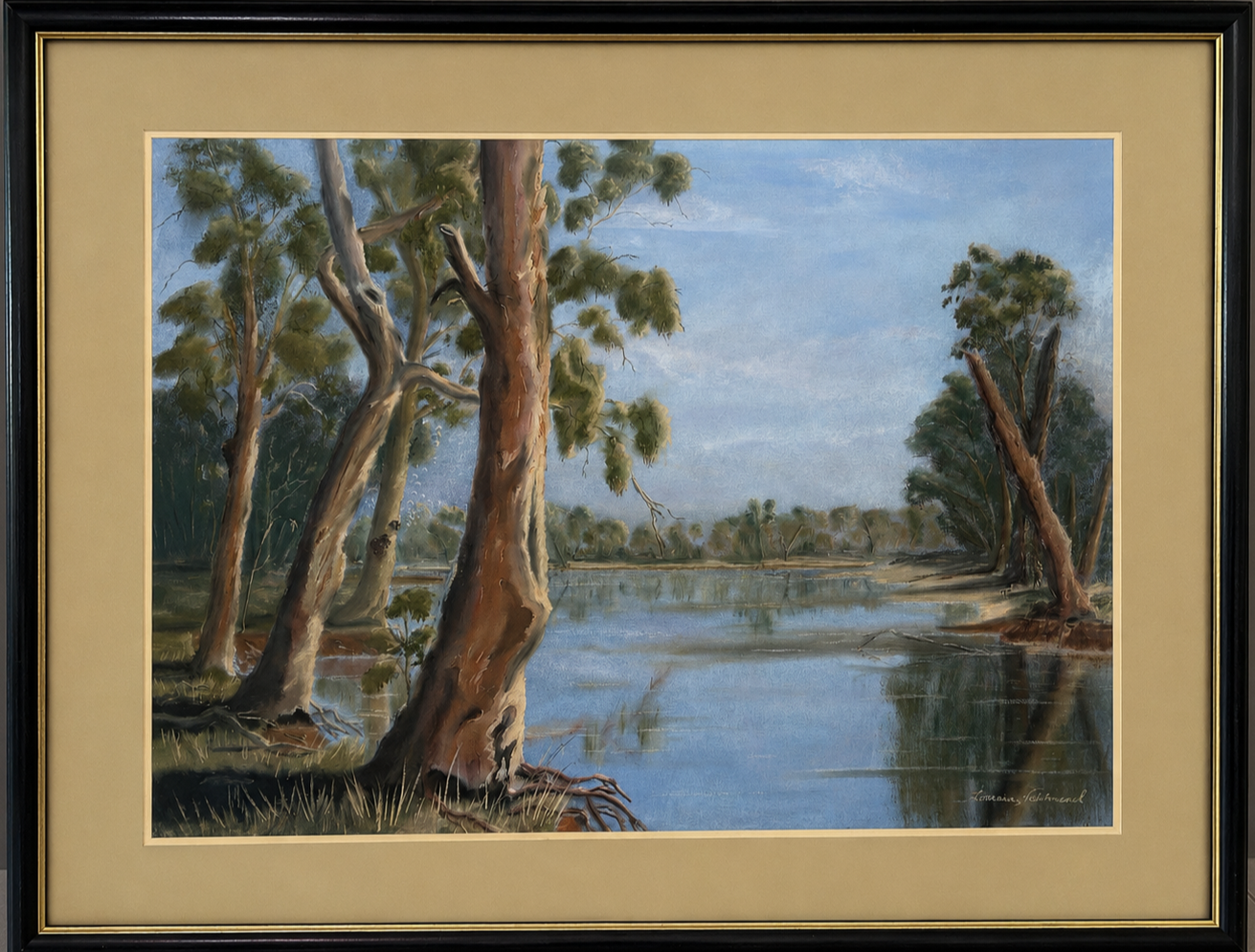 Australian river landscape lined with river red gums. Tall eucalyptus trees stand beside still blue water beneath a soft sky, with reflections and muted bush tones creating a peaceful rural atmosphere.