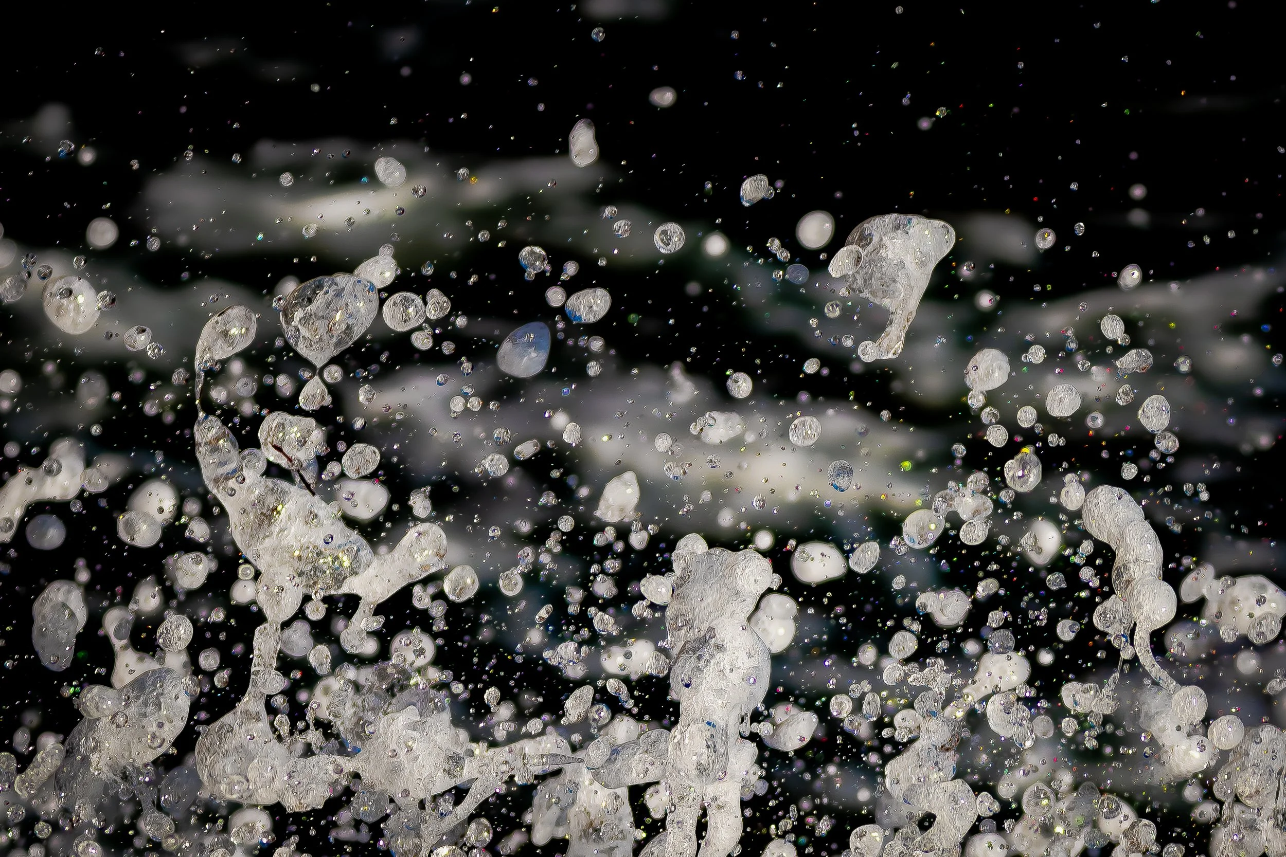 Look at the spaces between the droplets. What becomes visible?