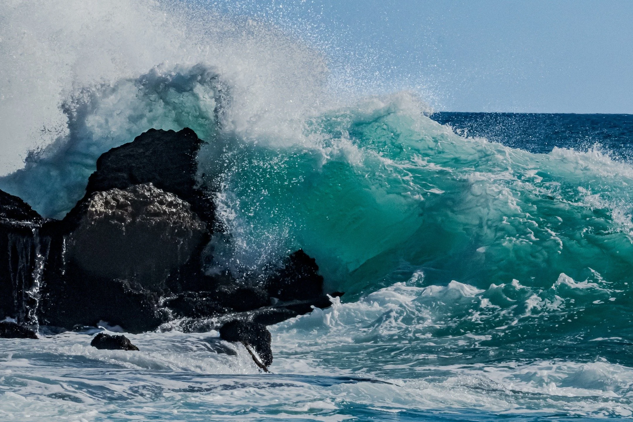 This photograph captures the dramatic impact of ocean waves colliding with rock, an awe-inspiring reminder of resilience and strength. It symbolizes endurance and the beauty found in persistence, making it an empowering piece to bring energy and dept