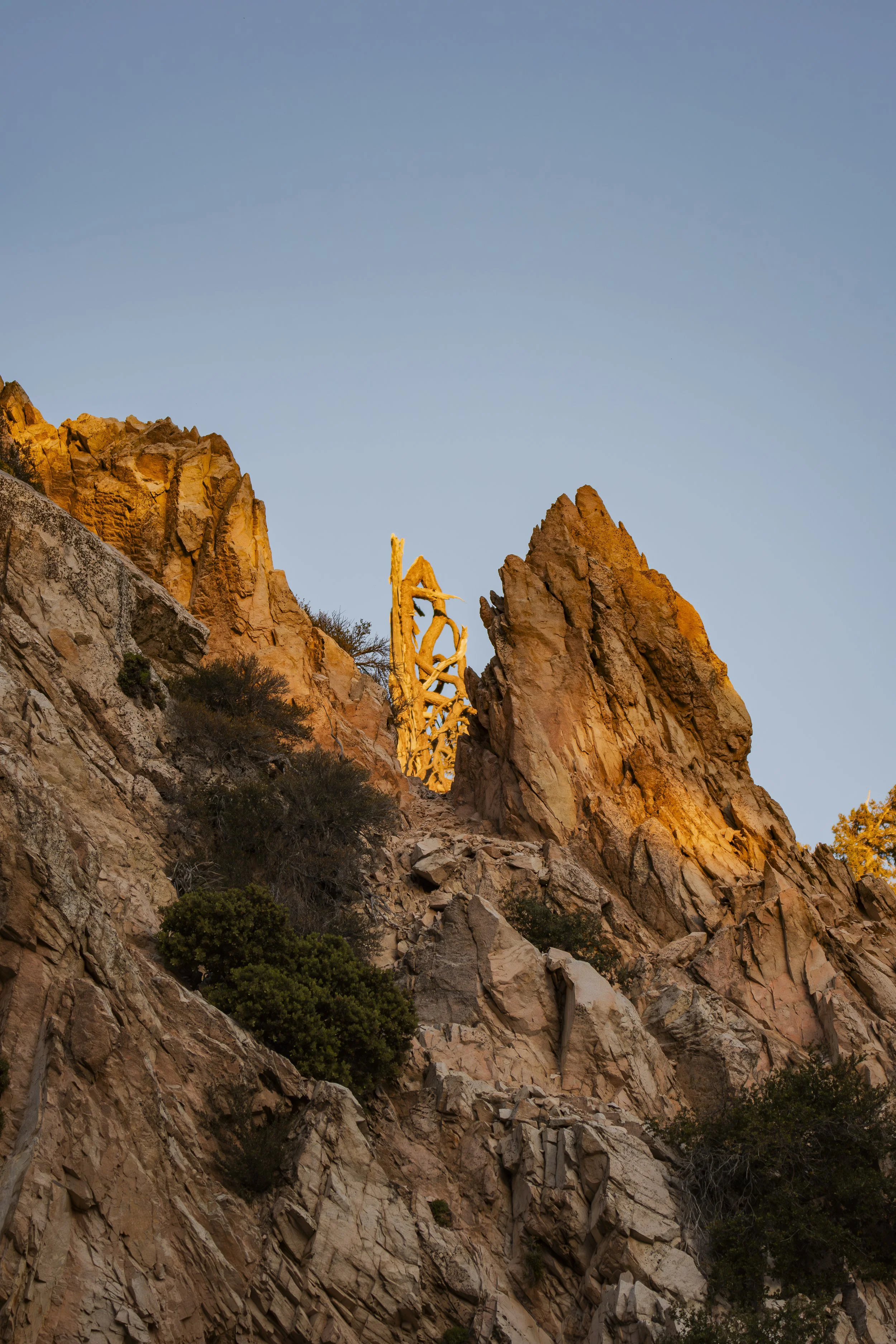 Where is the last sunlight touching the canyon? Follow the light with your eyes.