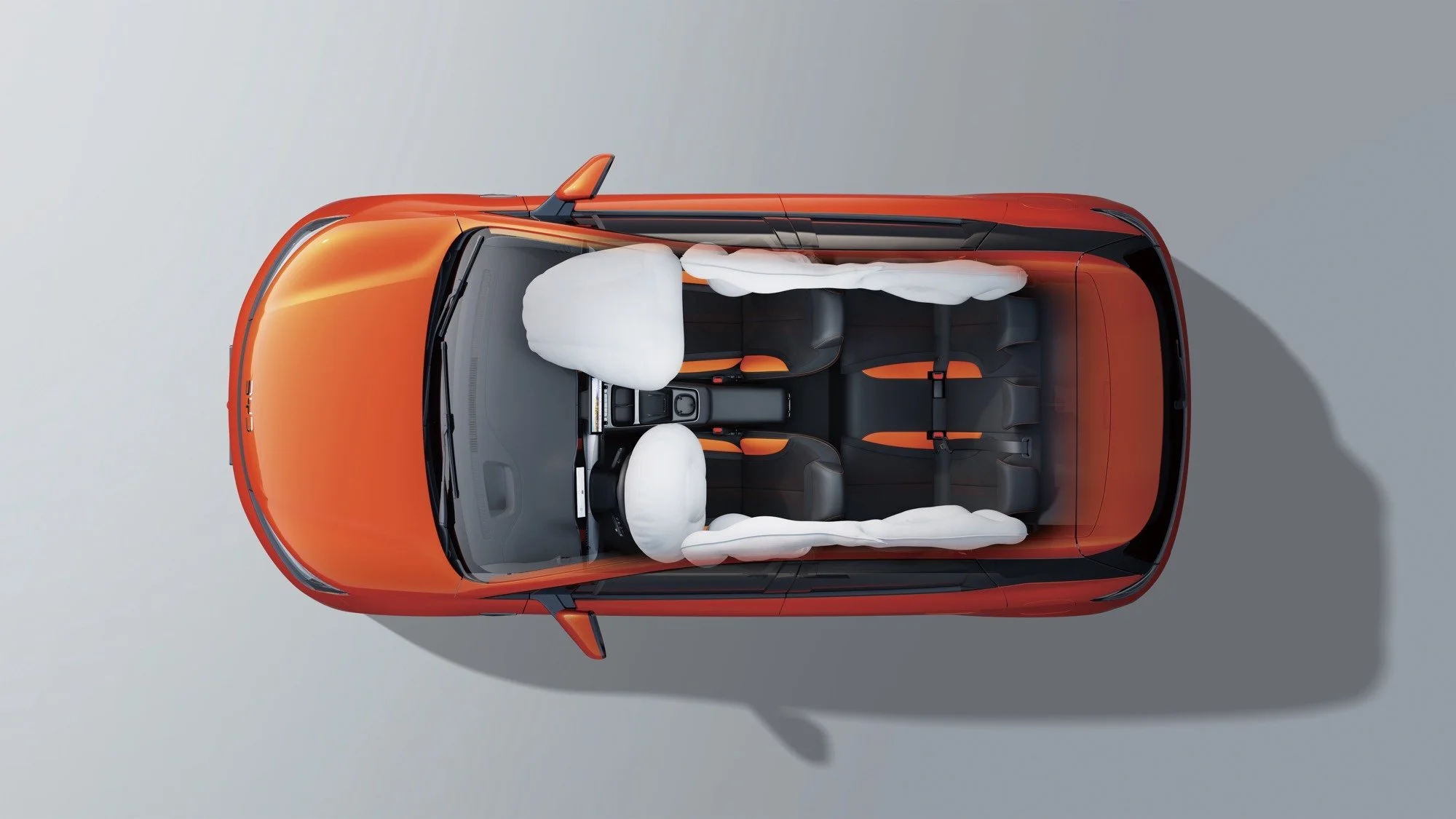 Ilustracja poduszek powietrznych w BYD Dolphin G — widok z góry na rozwinięte poduszki przednie i boczne