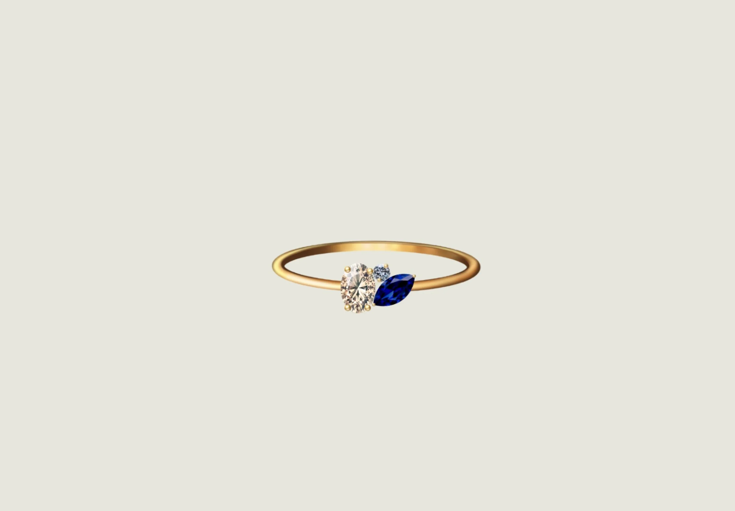 Dessin d'une bague en or orné d'un saphir jaune, un diamant rond et un saphir bleu.