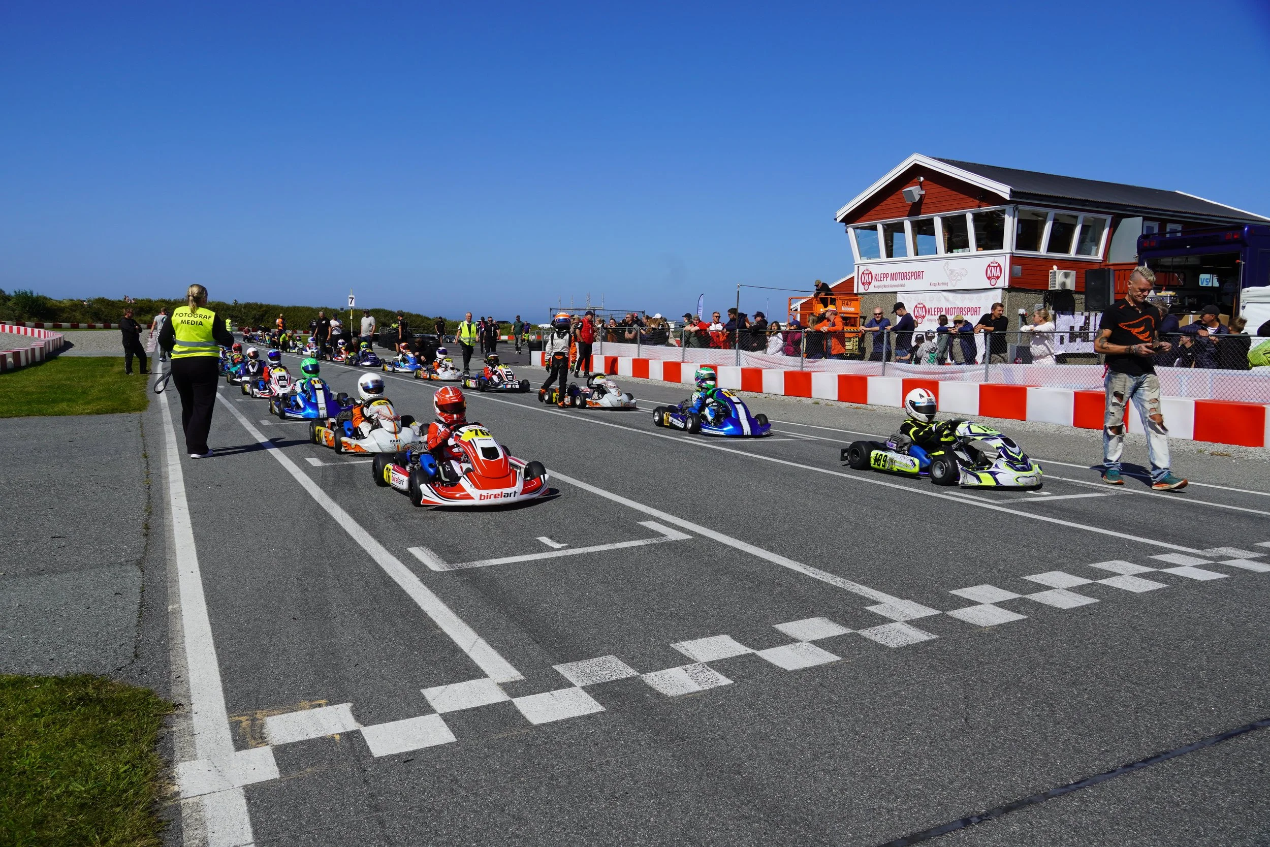 Gokart drivers lined up at starting grid