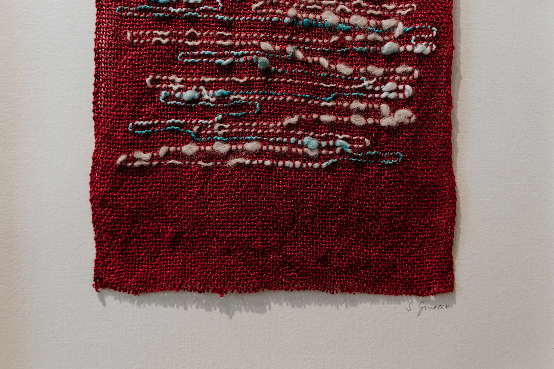 Red woven artwork